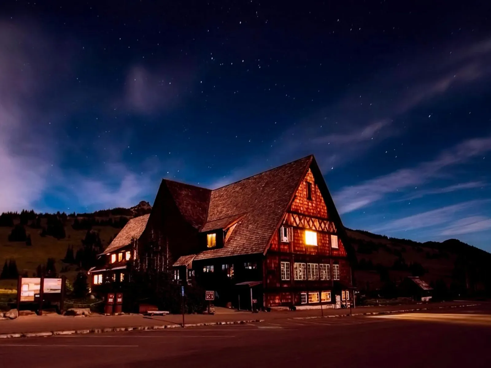 a house with a large driveway at night