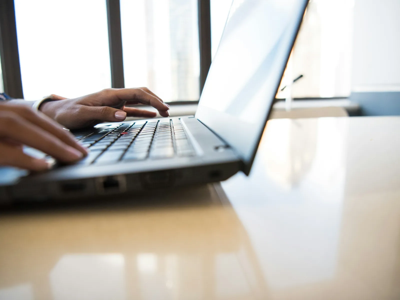a person typing on a laptop