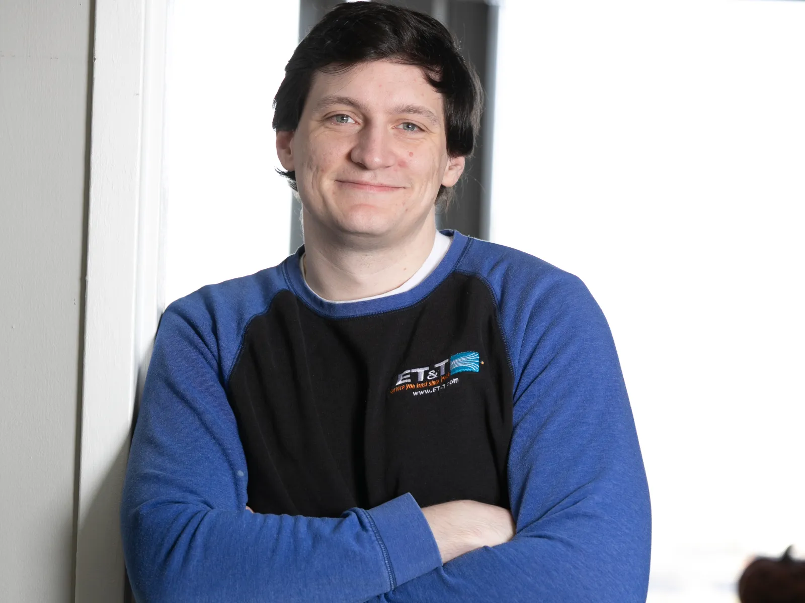 a man folding his arms