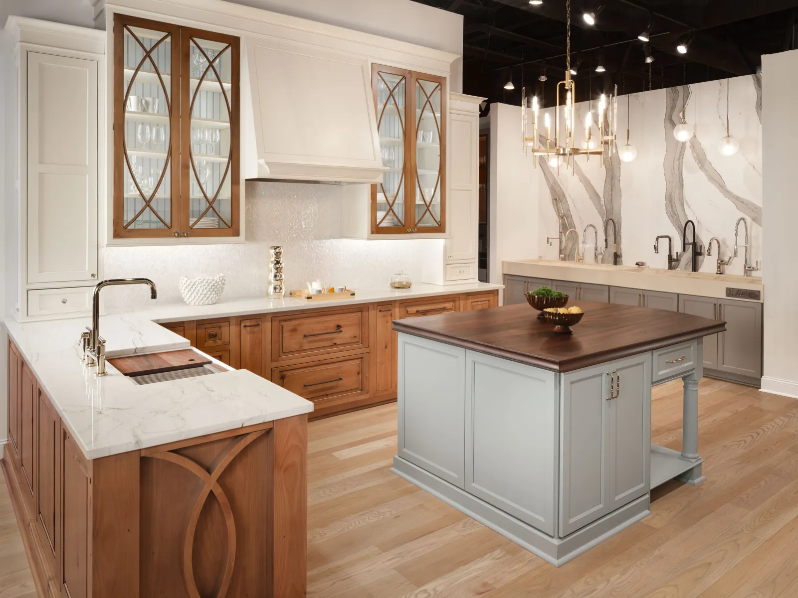 Modern kitchen design featuring wooden cabinets, elegant countertops, and stylish lighting fixtures.