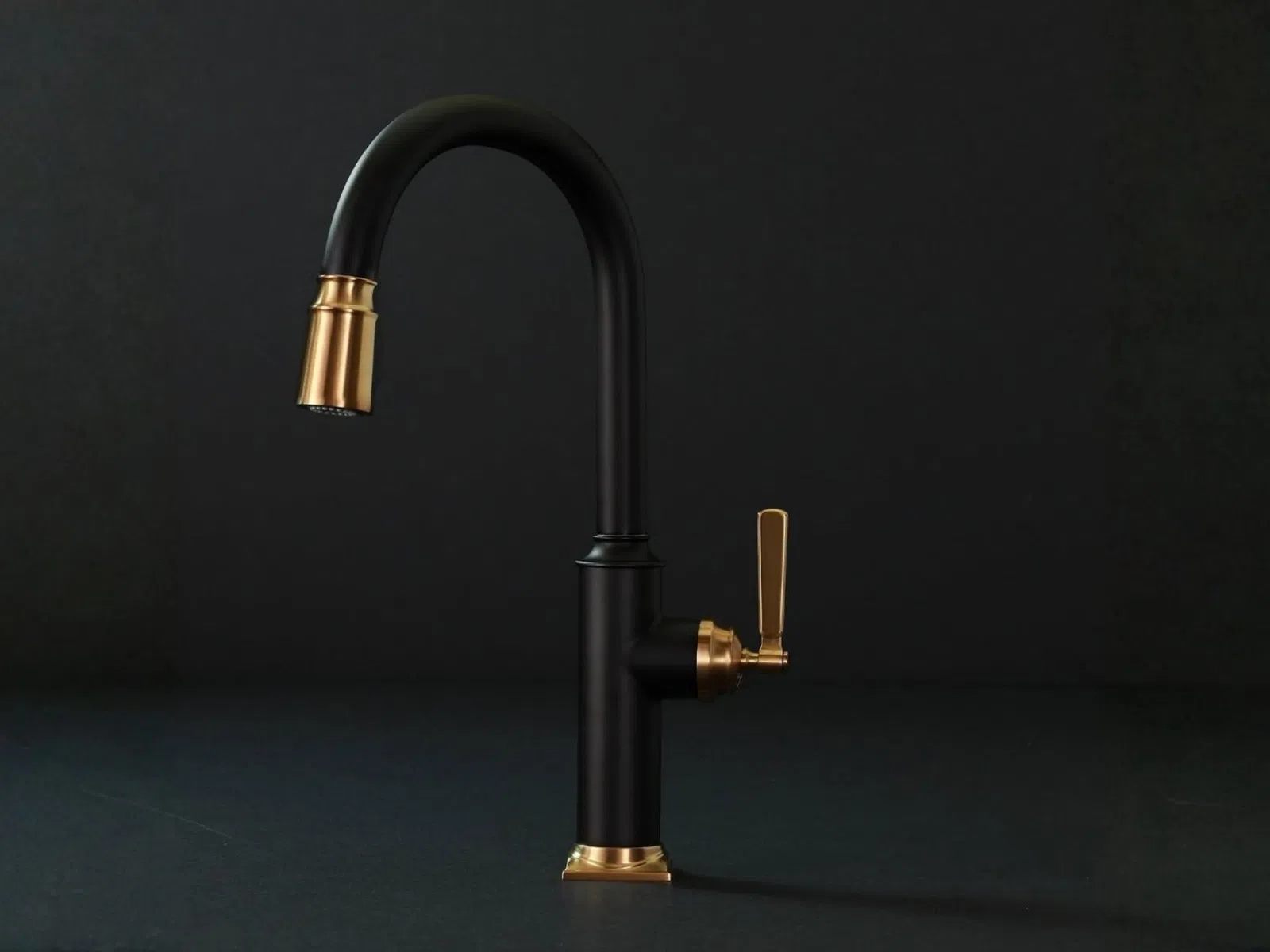 Matte black kitchen faucet with gold accents on handle and spout against a dark background.