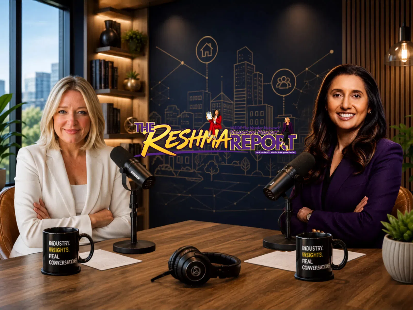 Two women hosts smiling in a podcast studio with microphones, coffee mugs, and a city-themed backdrop