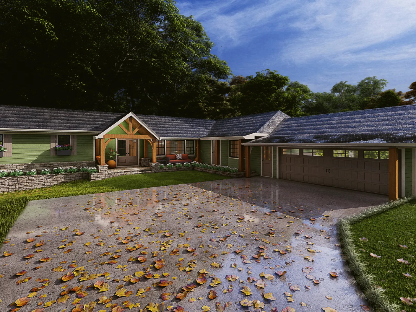 Charming green house surrounded by lush trees, with a driveway covered in autumn leaves after rain.