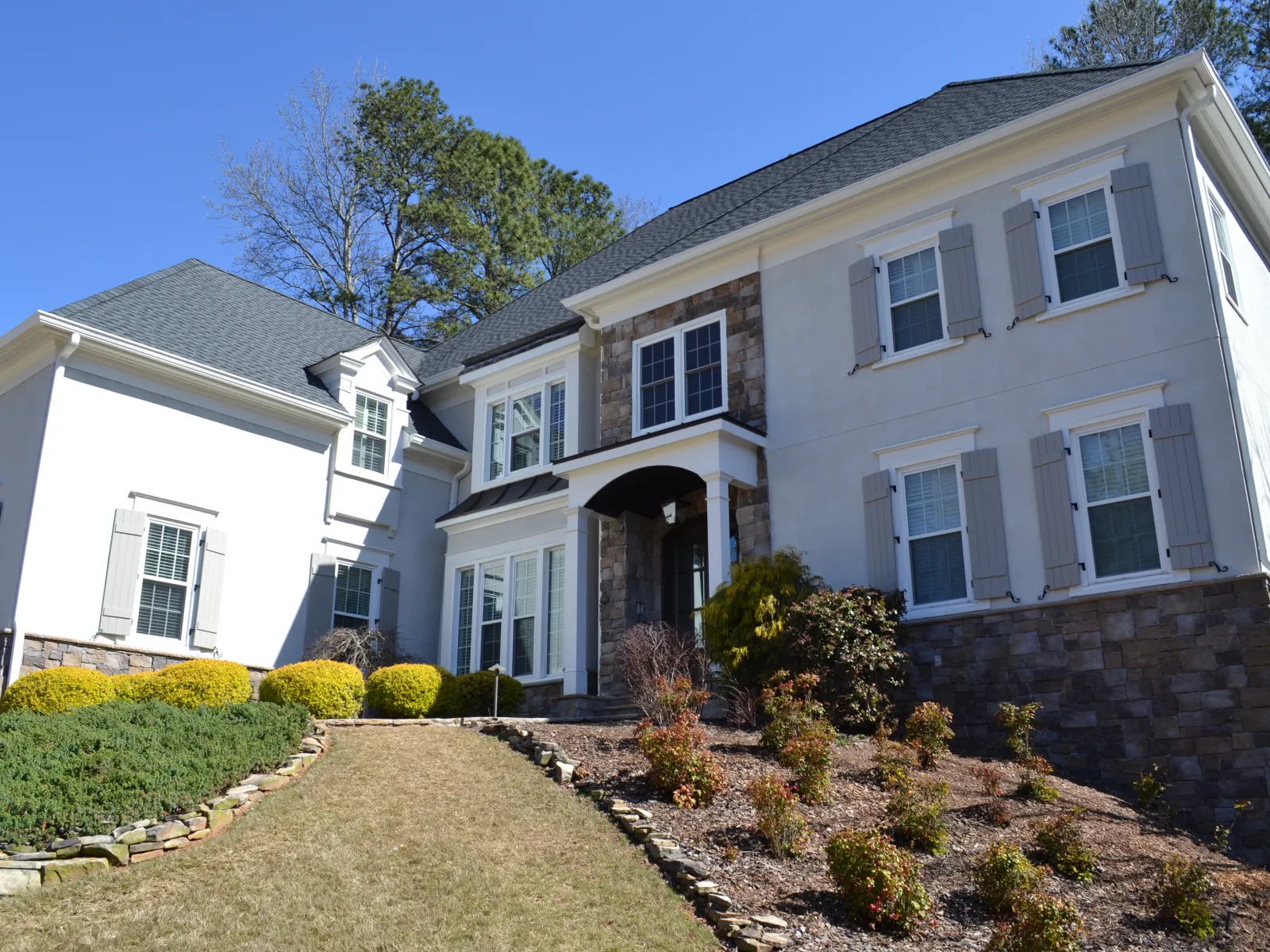 a house with a brick driveway