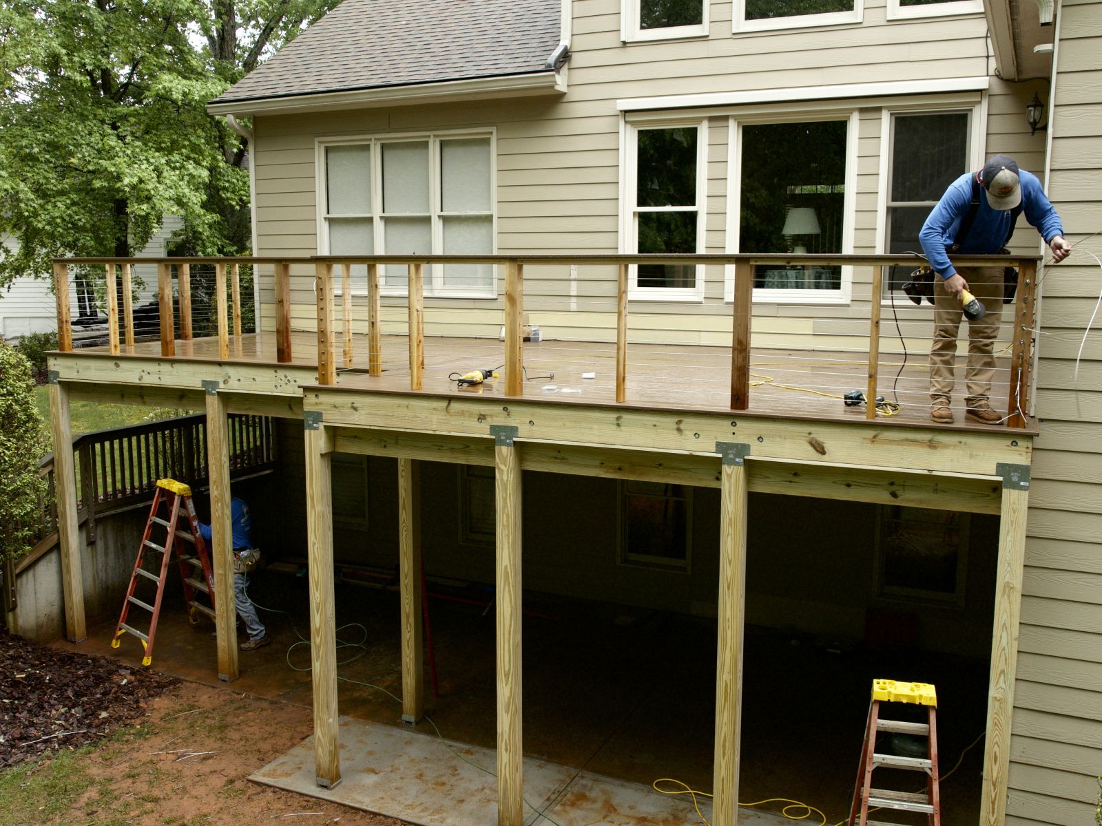 a person on a ladder on a house