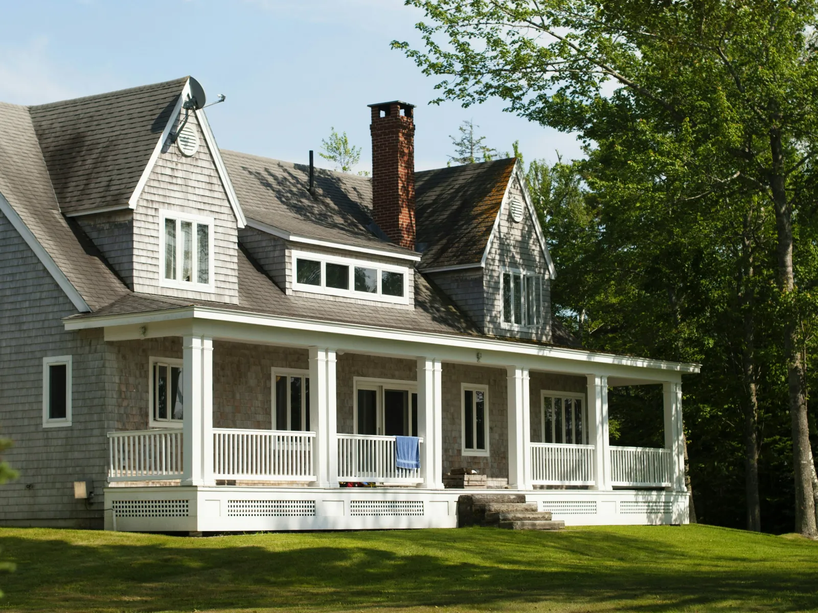 a large house with a lawn in front of it