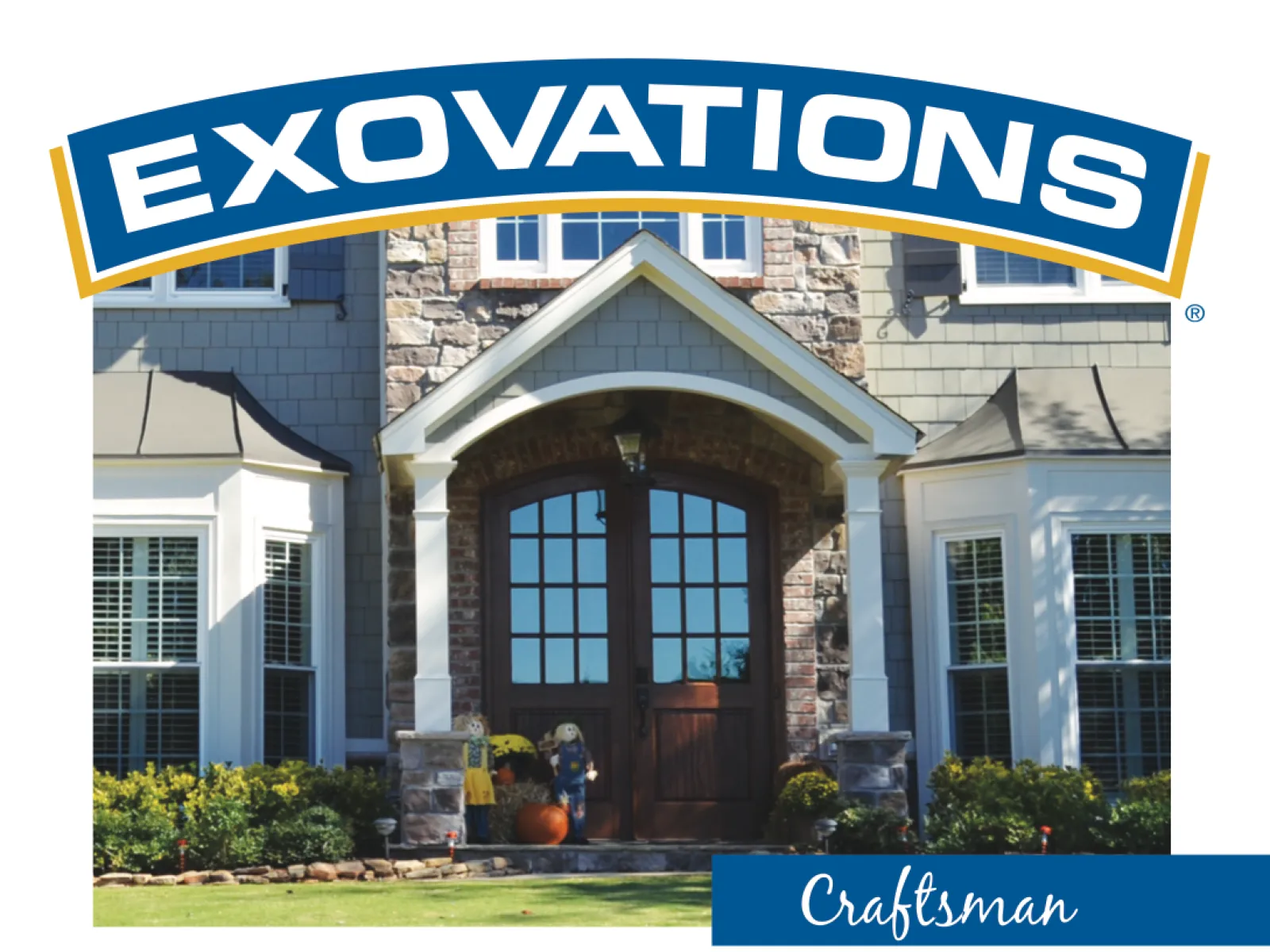 Craftsman style portico entrance with arched double doors, stone columns, and gable roof on a residential home.