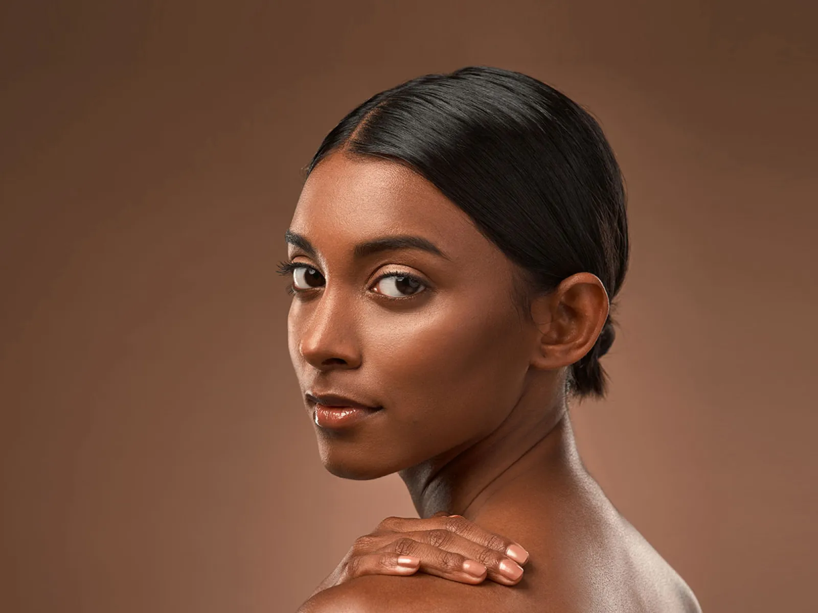 A woman with long hair Rhinoplasty Cumming Facial Aesthetic Surgery