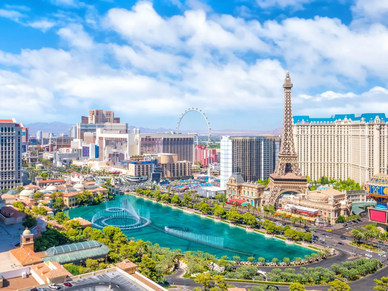 a city with a pool and a tower in the middle