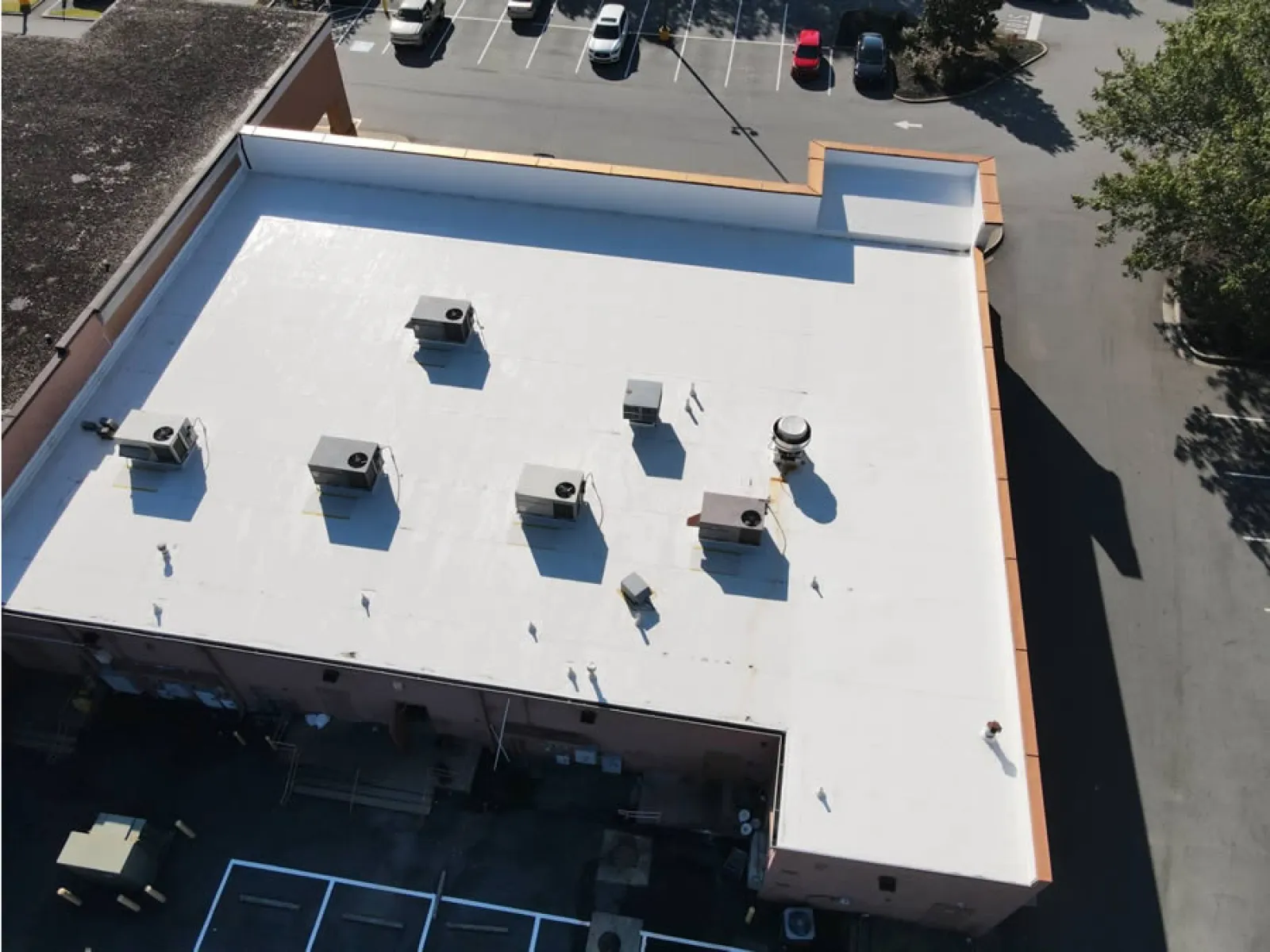 a rooftop with cars parked on it