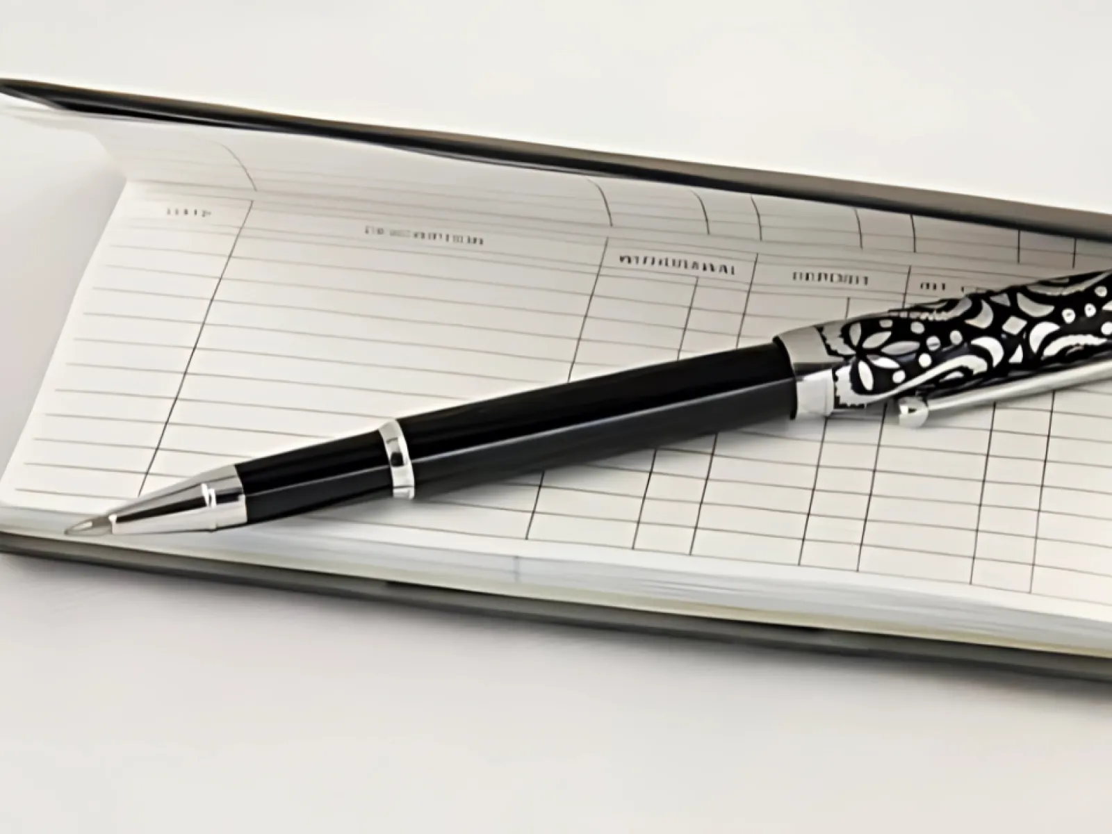 a pen on a piece of paper