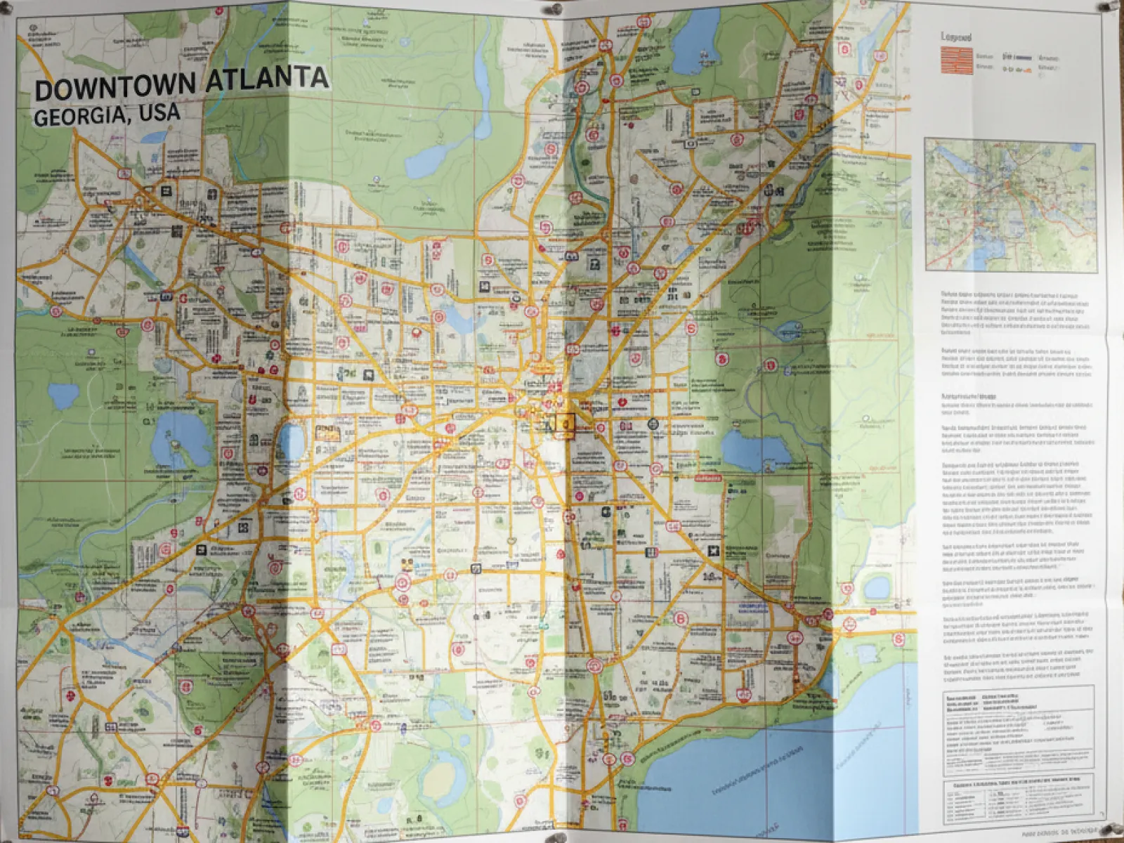 Detailed map of Downtown Atlanta, Georgia showing streets, highways, parks, and landmarks with legend and inset.