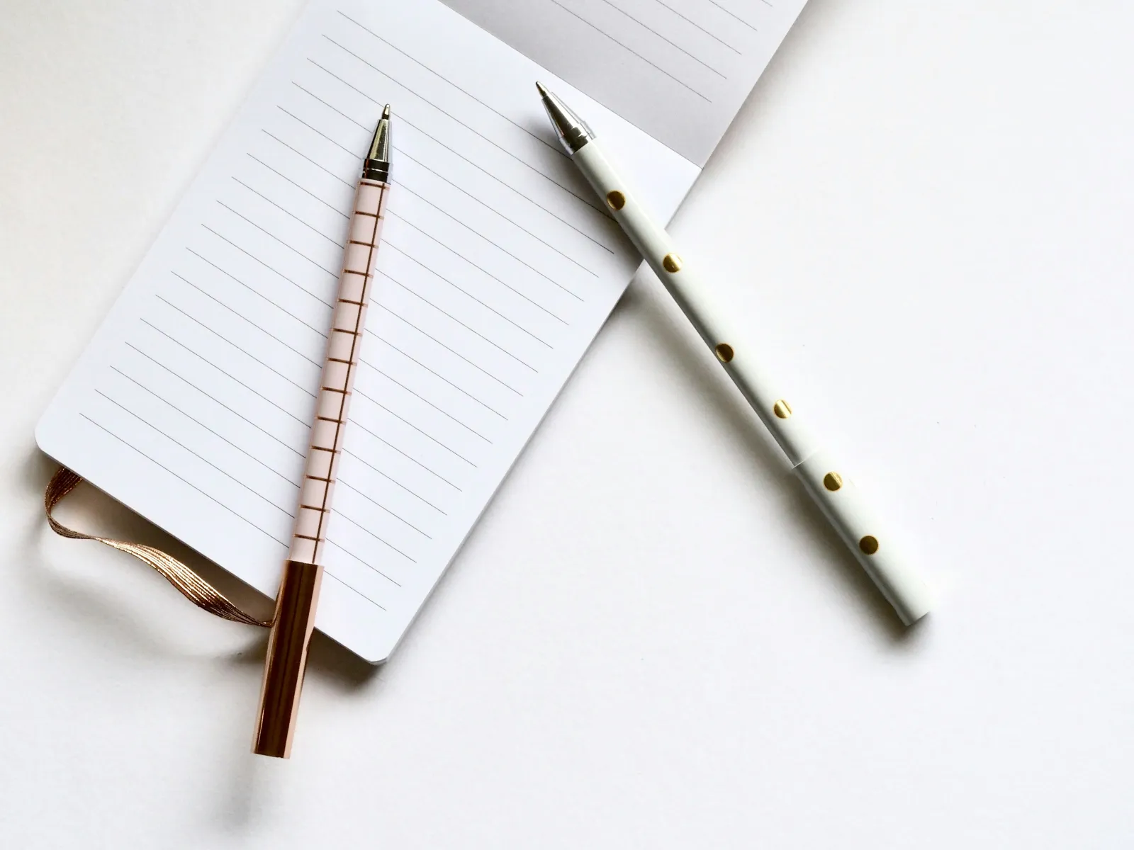 a few pens and a notebook