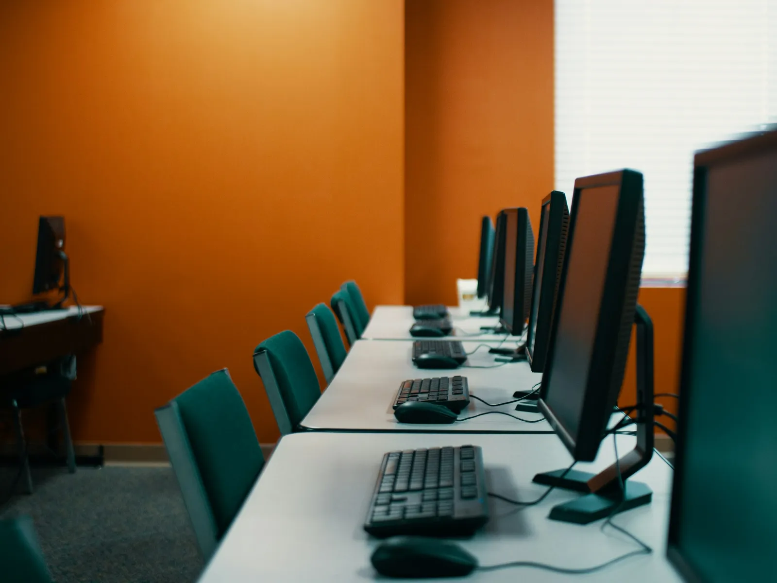 a desk with several computers