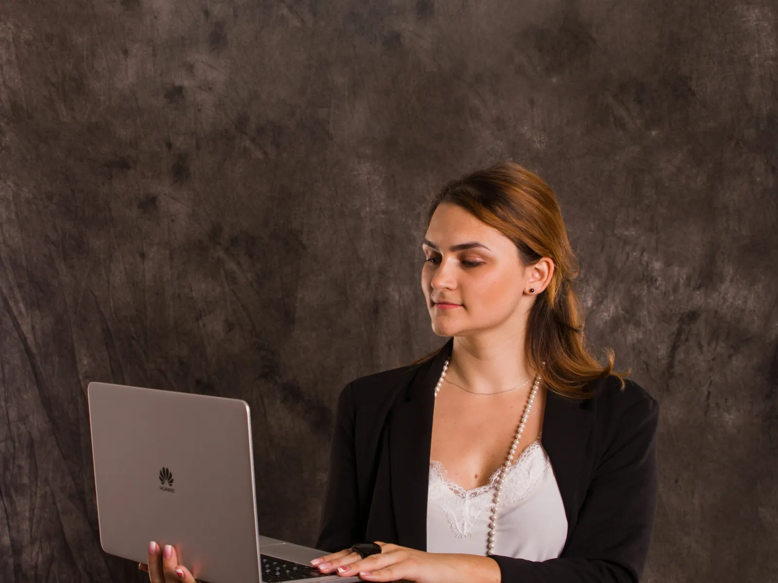 a person holding a laptop