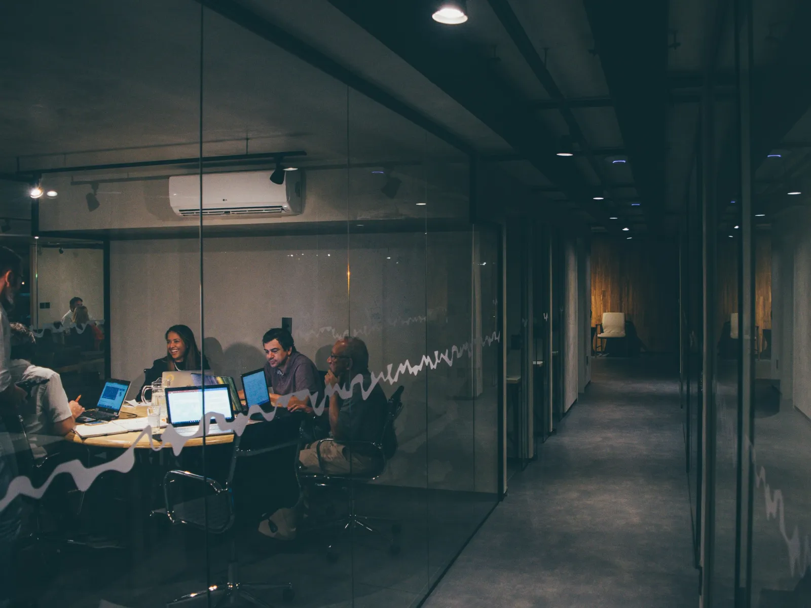 a group of people working at computers