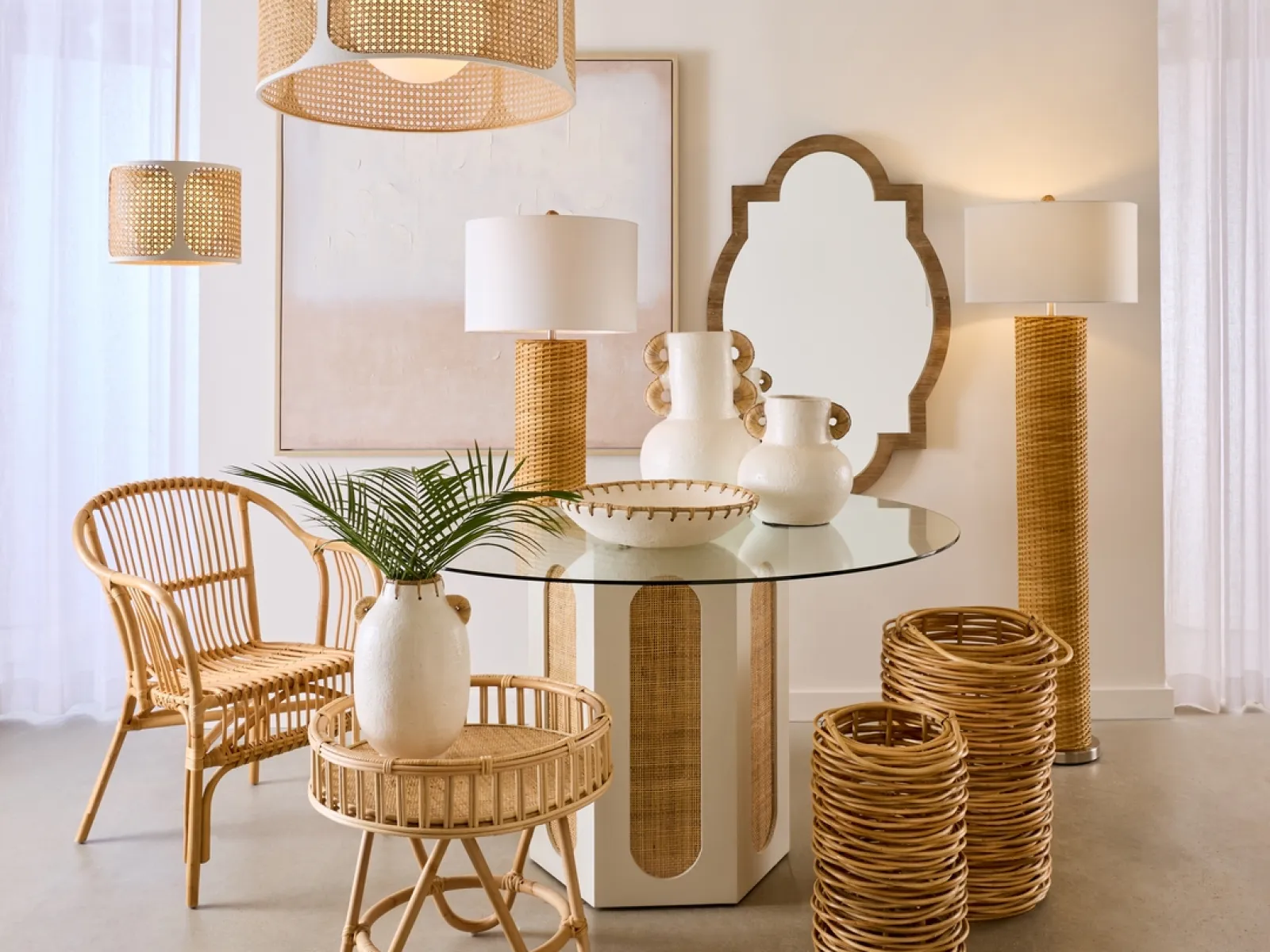 Modern natural decor with wicker furniture, glass table, ceramic vases, and soft lighting in neutral tones.