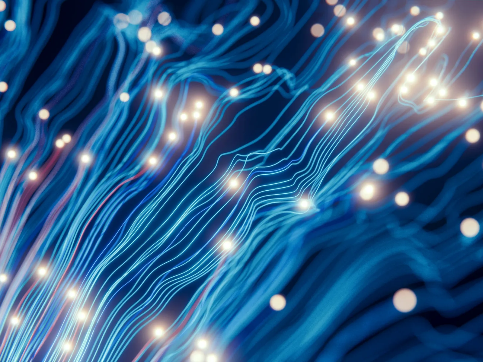 Abstract blue fiber optic lines with glowing light points representing data transmission and technology.