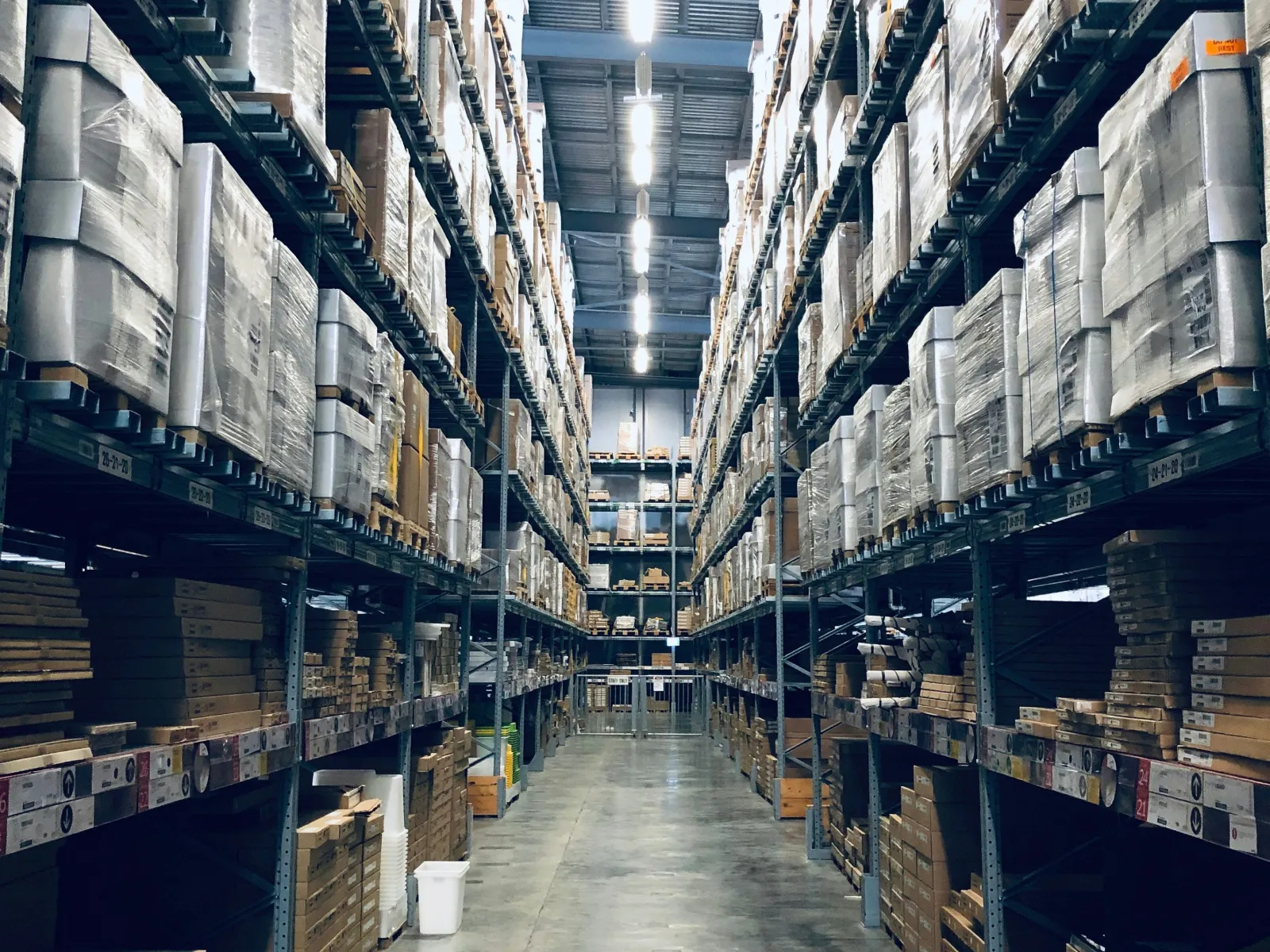a long hallway with many bookshelves
