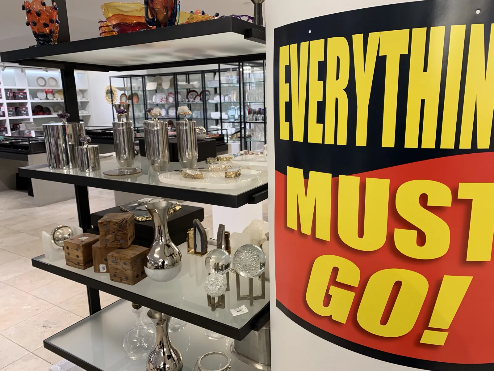 a display case with glasses and objects