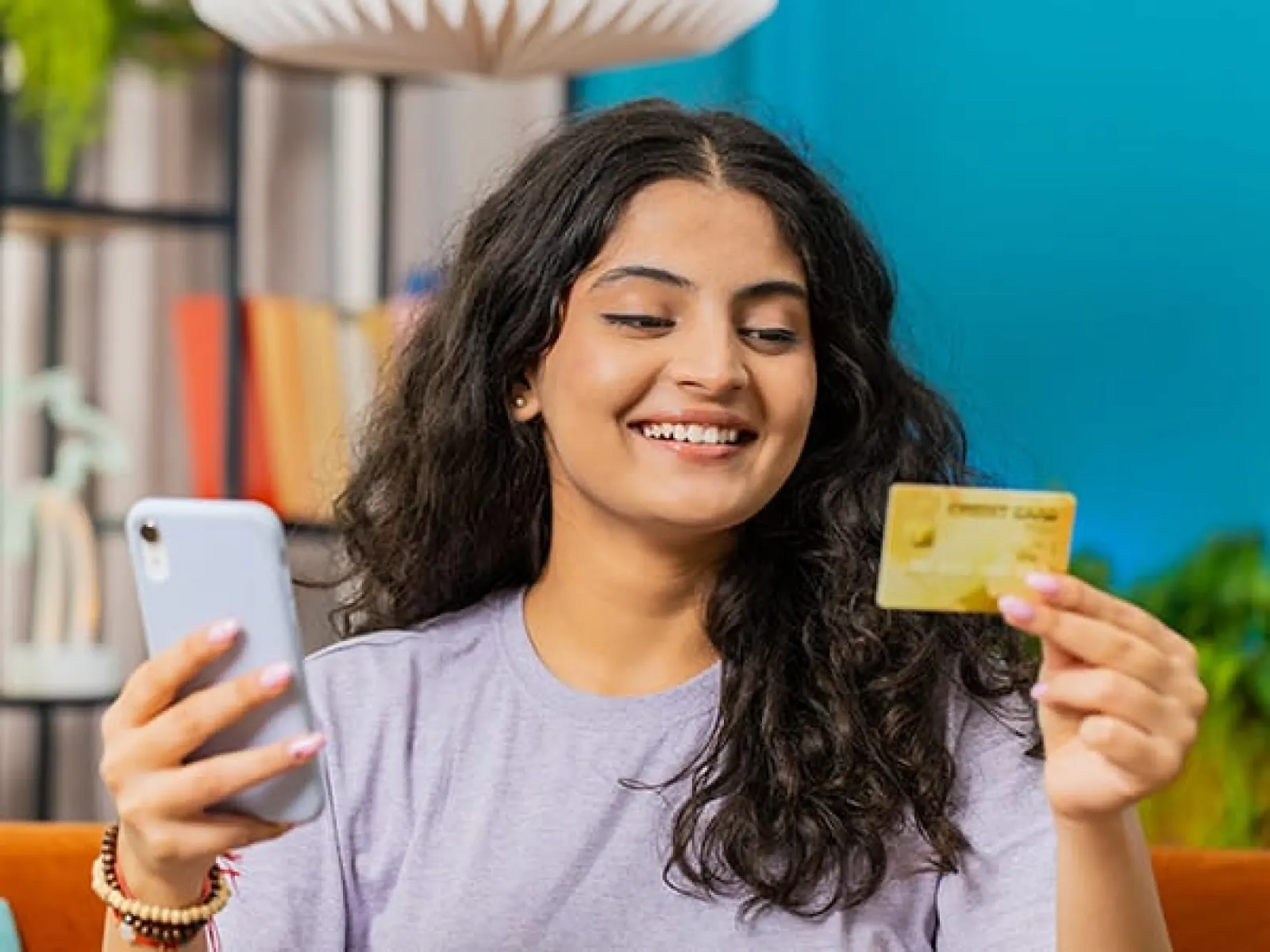 a person holding a card and smiling