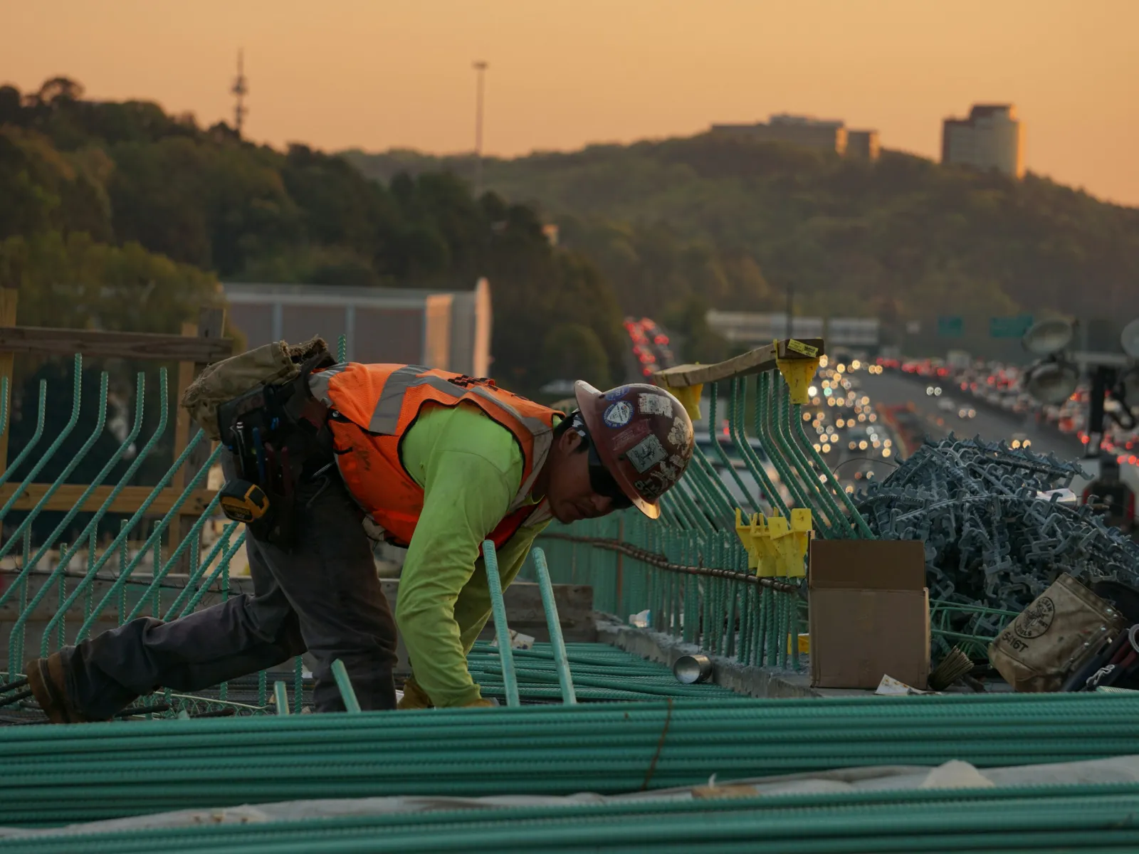 a person wearing a helmet and climbing a railing