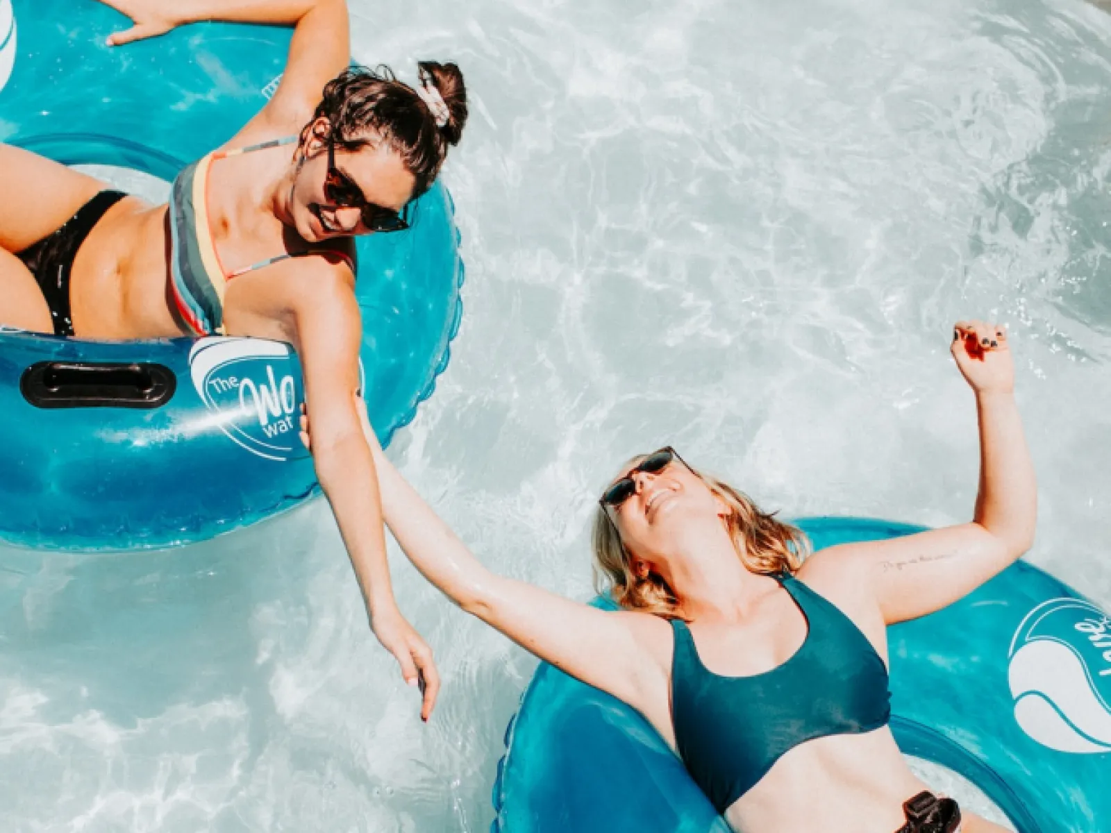 a man and woman in a pool