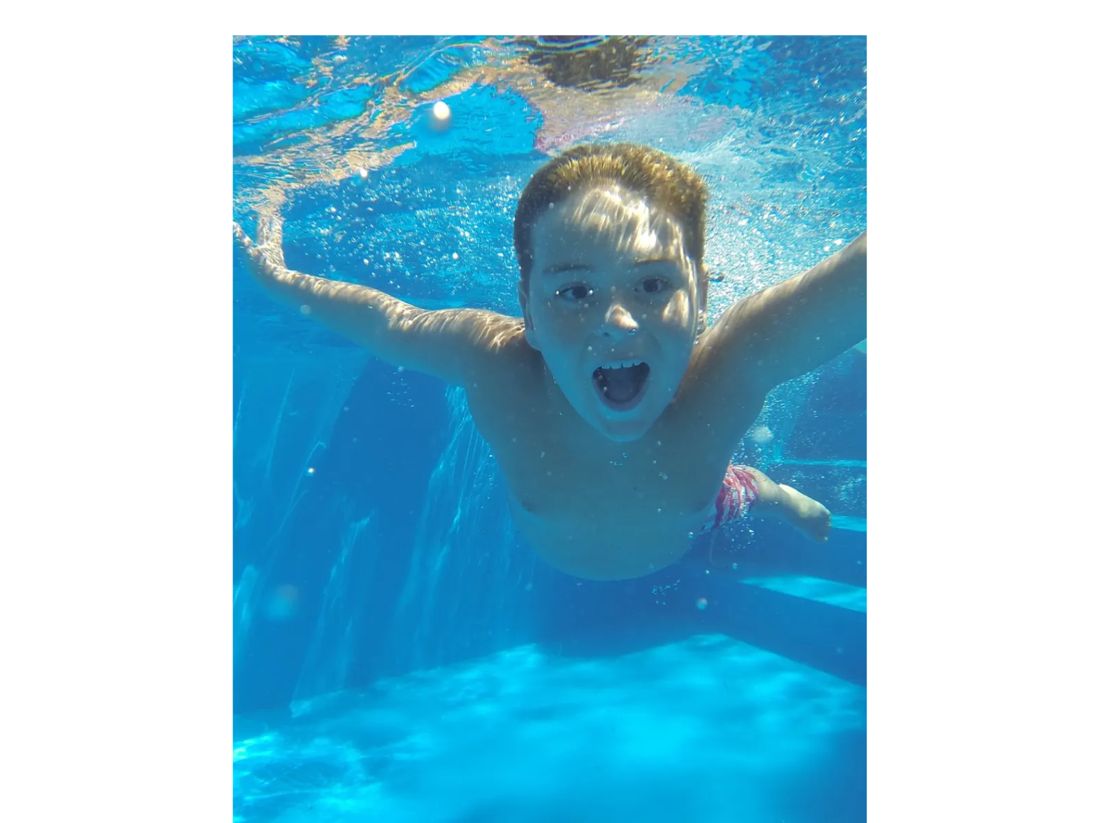 a boy in a pool
