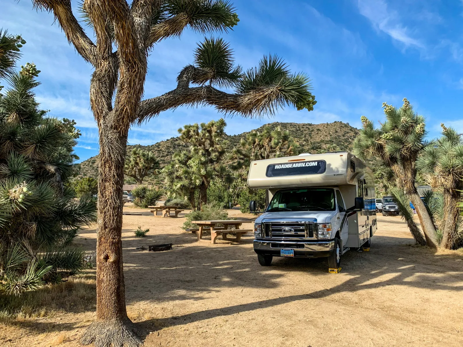 a truck parked on a dirt road