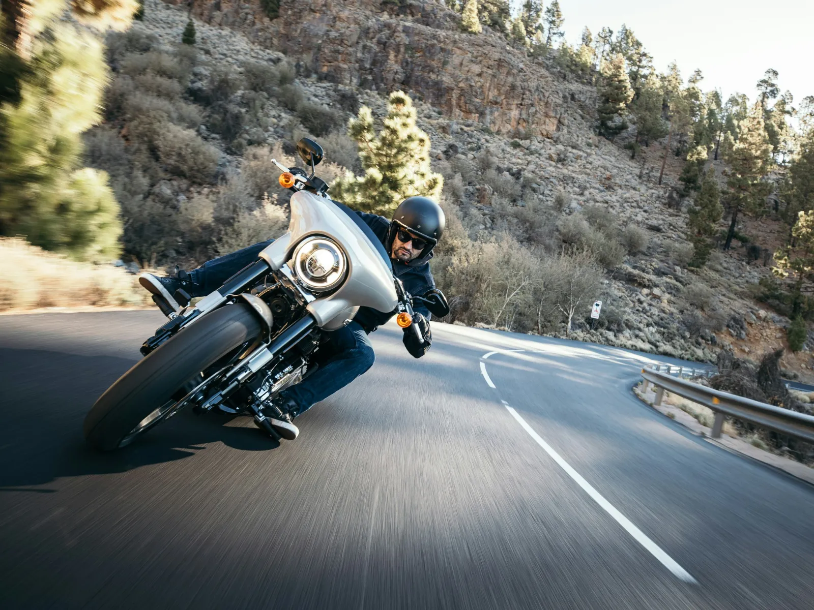 a person riding a motorcycle on a road