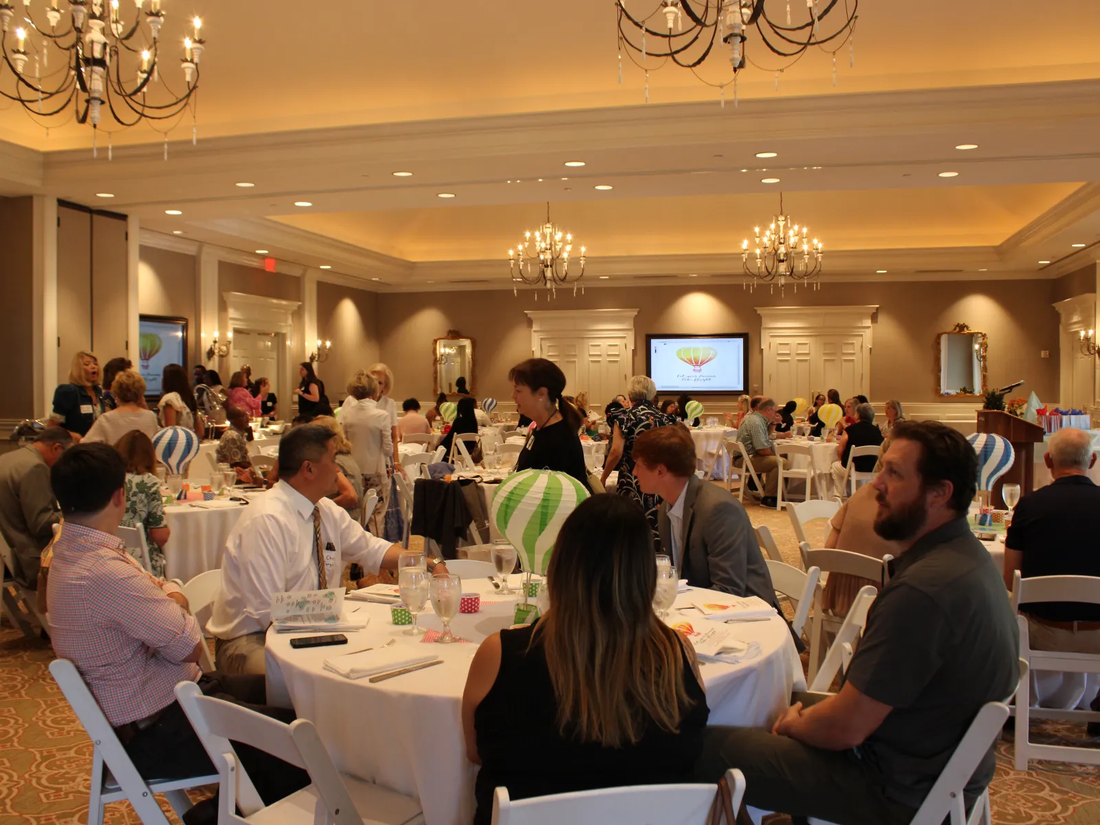 a group of people sitting at tables