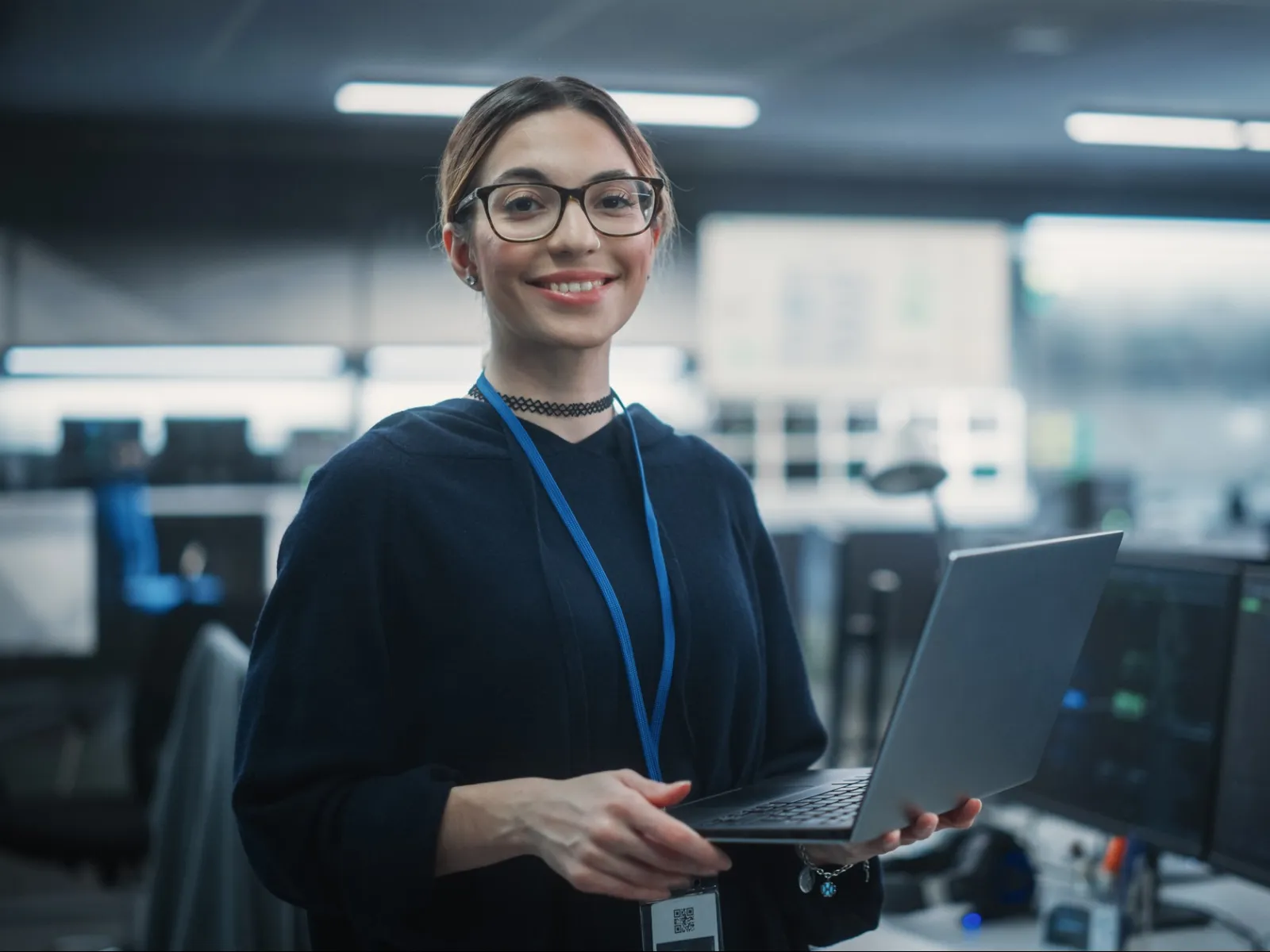 a person holding a laptop