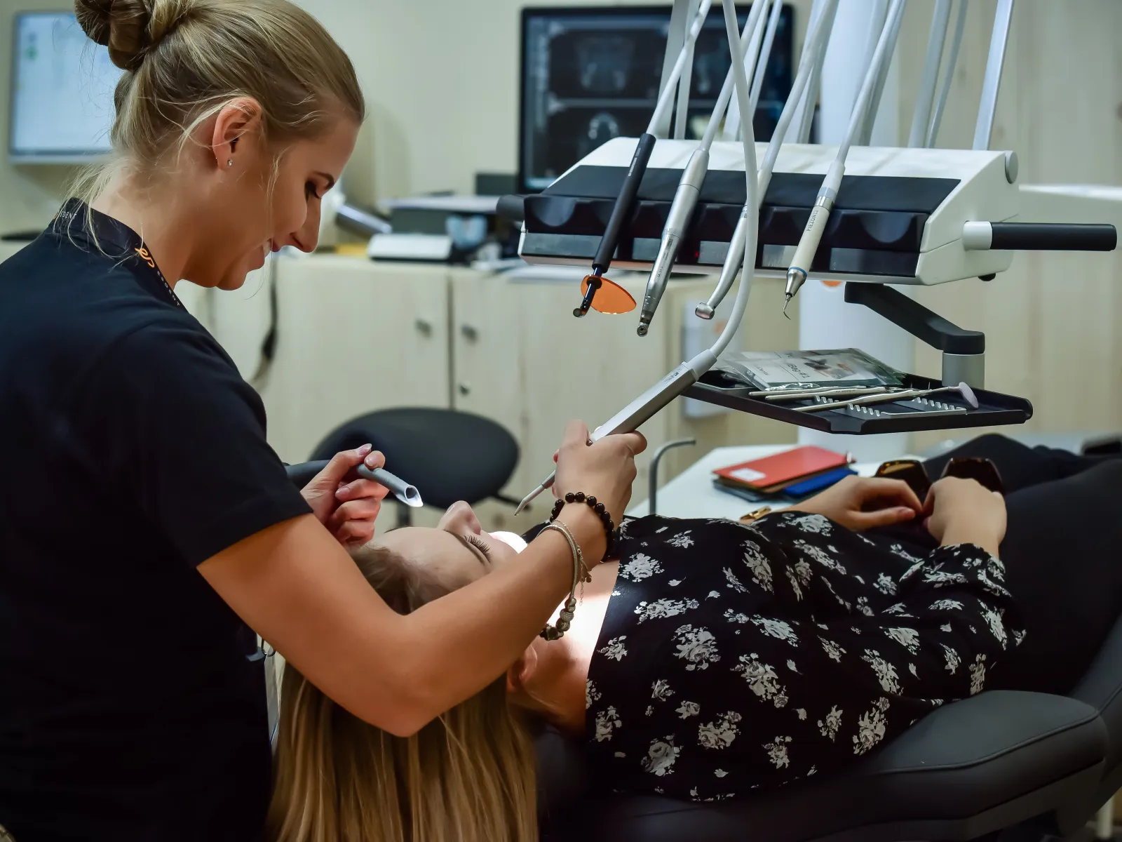 dentist checking patient mouth