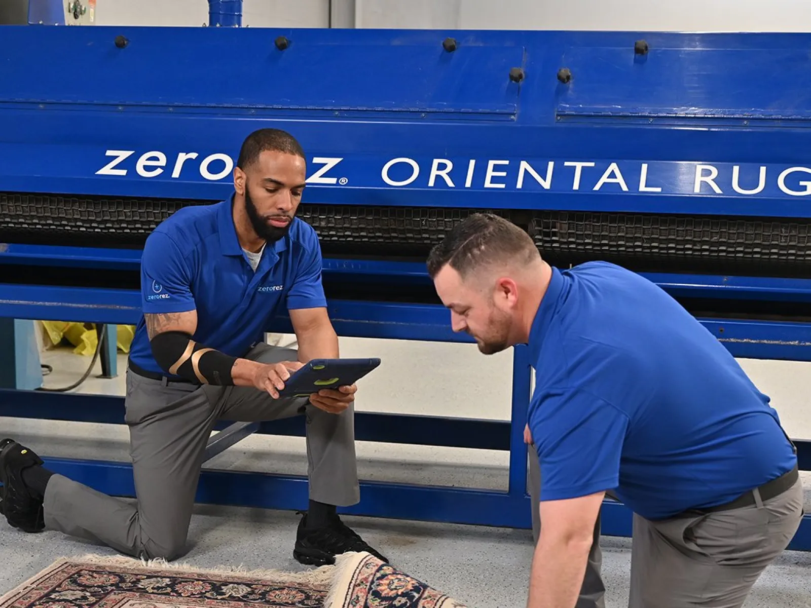 a couple of men looking at a map on a table