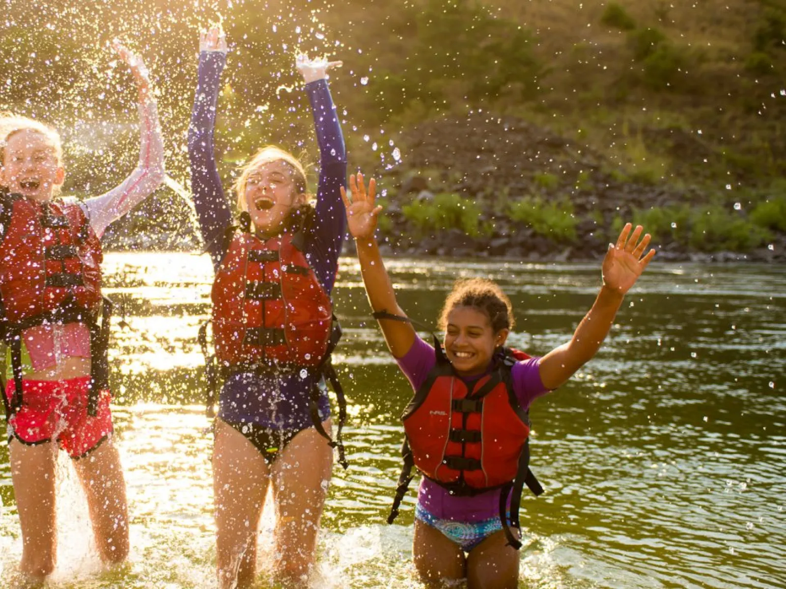 a group of children in water