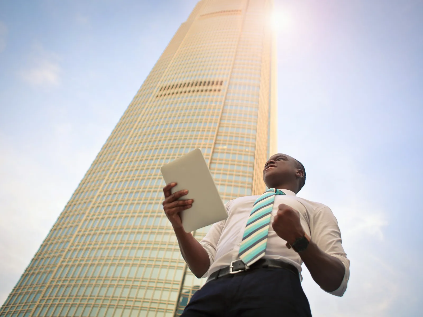 a man holding a laptop
