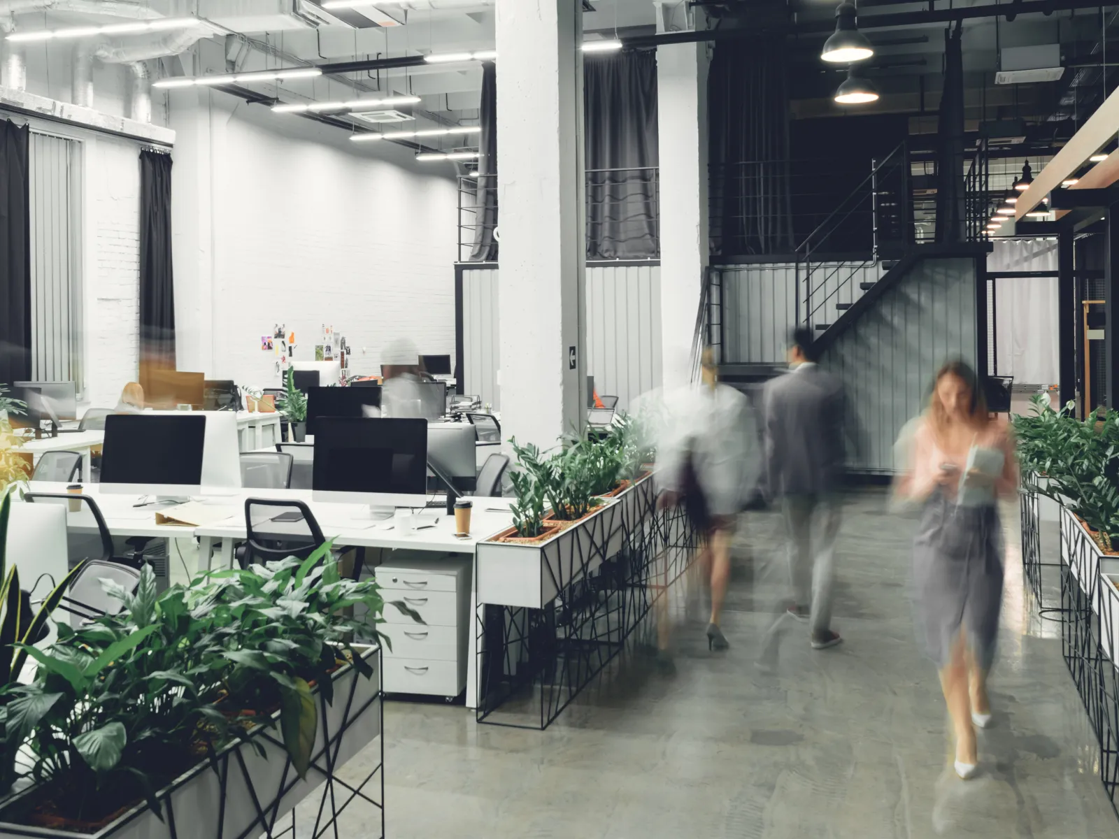 a group of people walking in a building