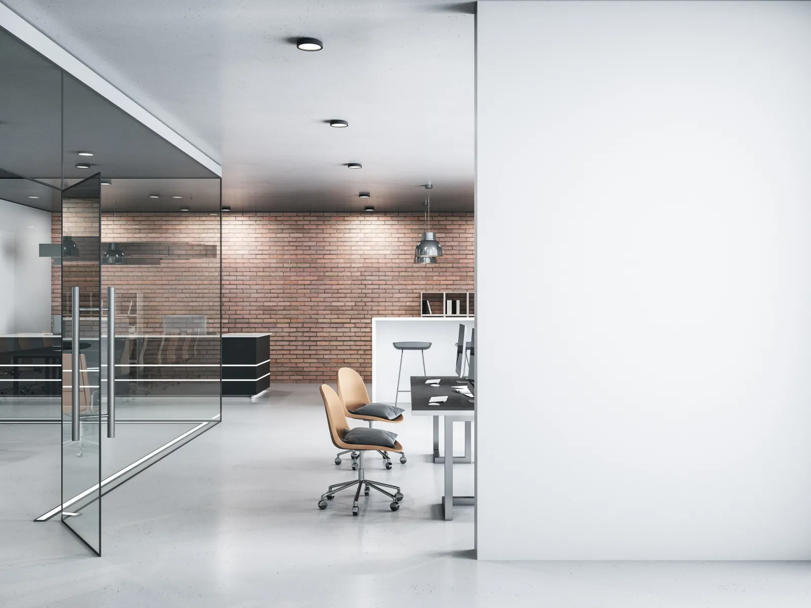 Modern office with glass walls, brick accent wall, ergonomic chairs, and desks with computers in bright space