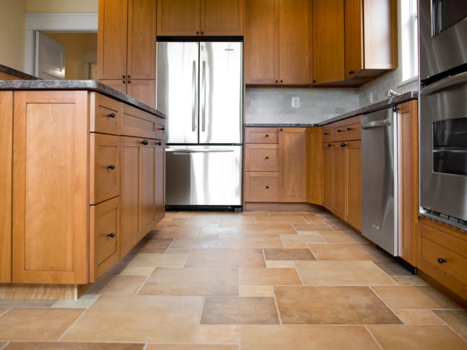 a kitchen with wooden cabinets
