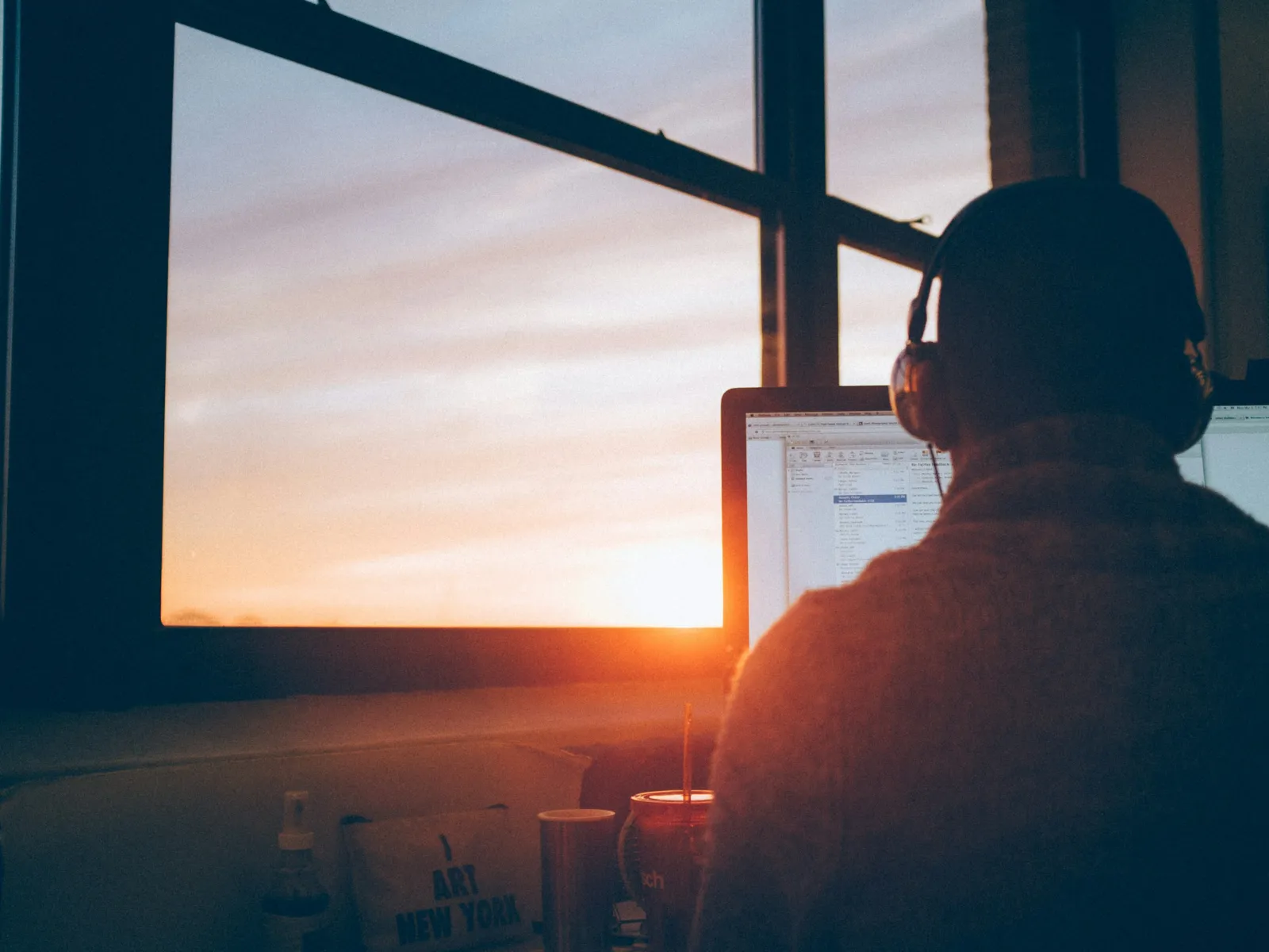 a man sitting in front of a computer