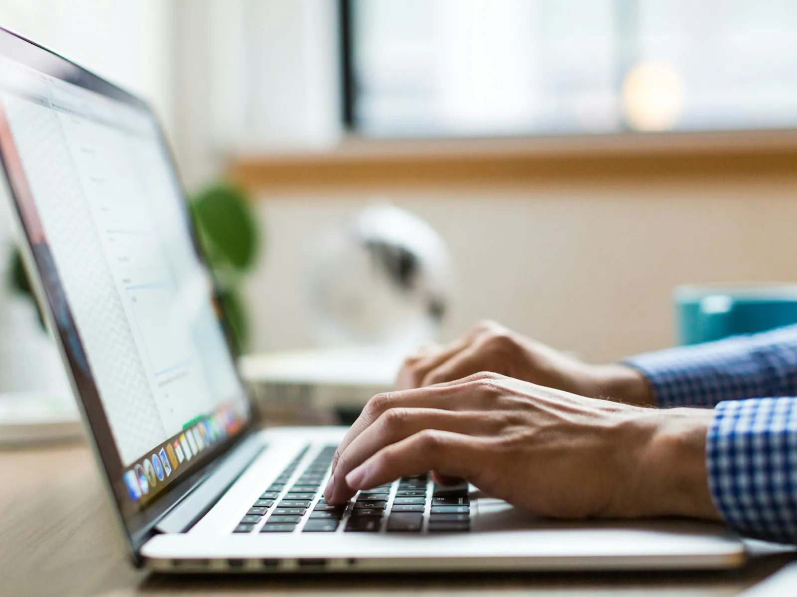 a person typing on a laptop