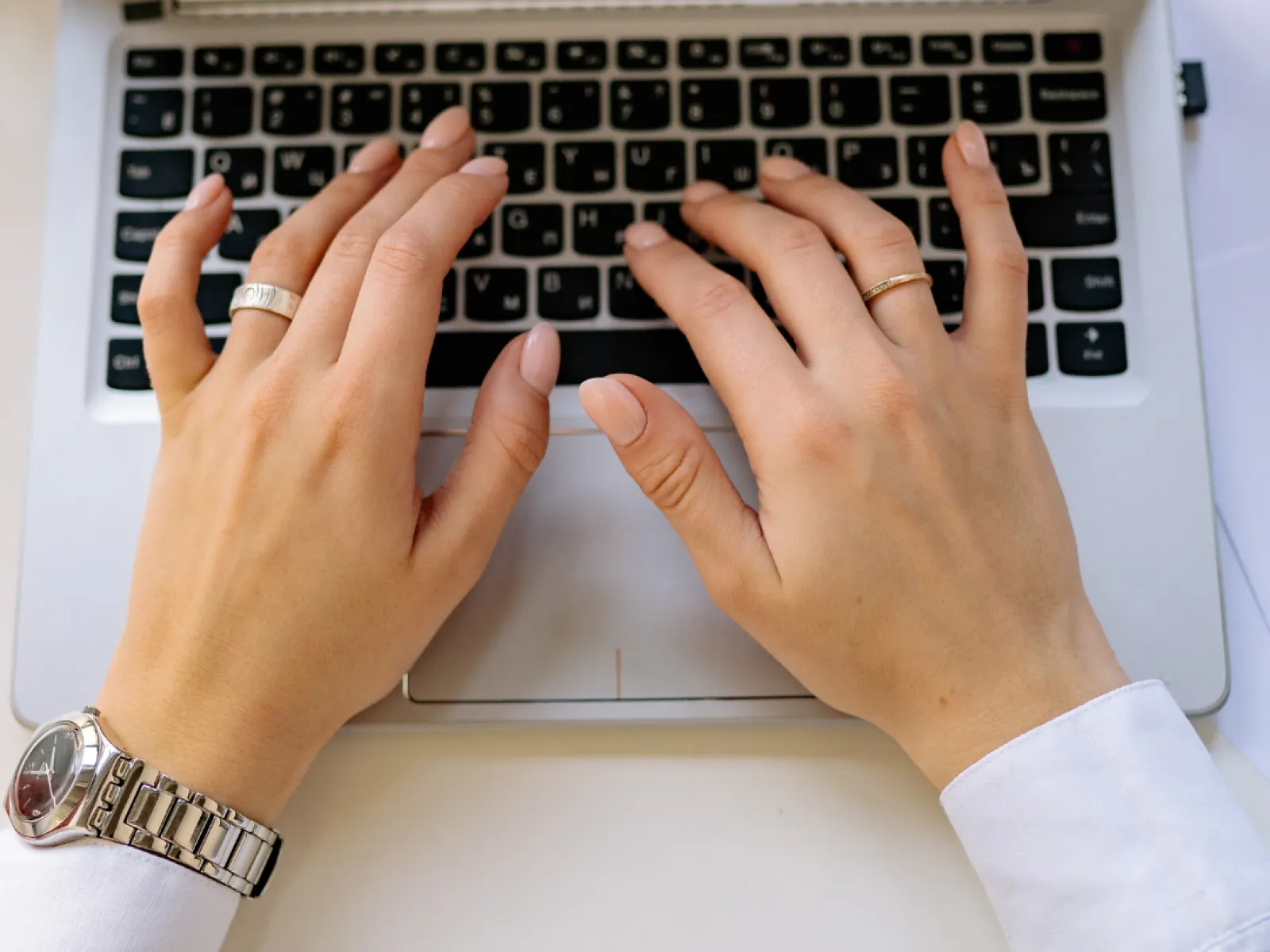 a person typing on a laptop