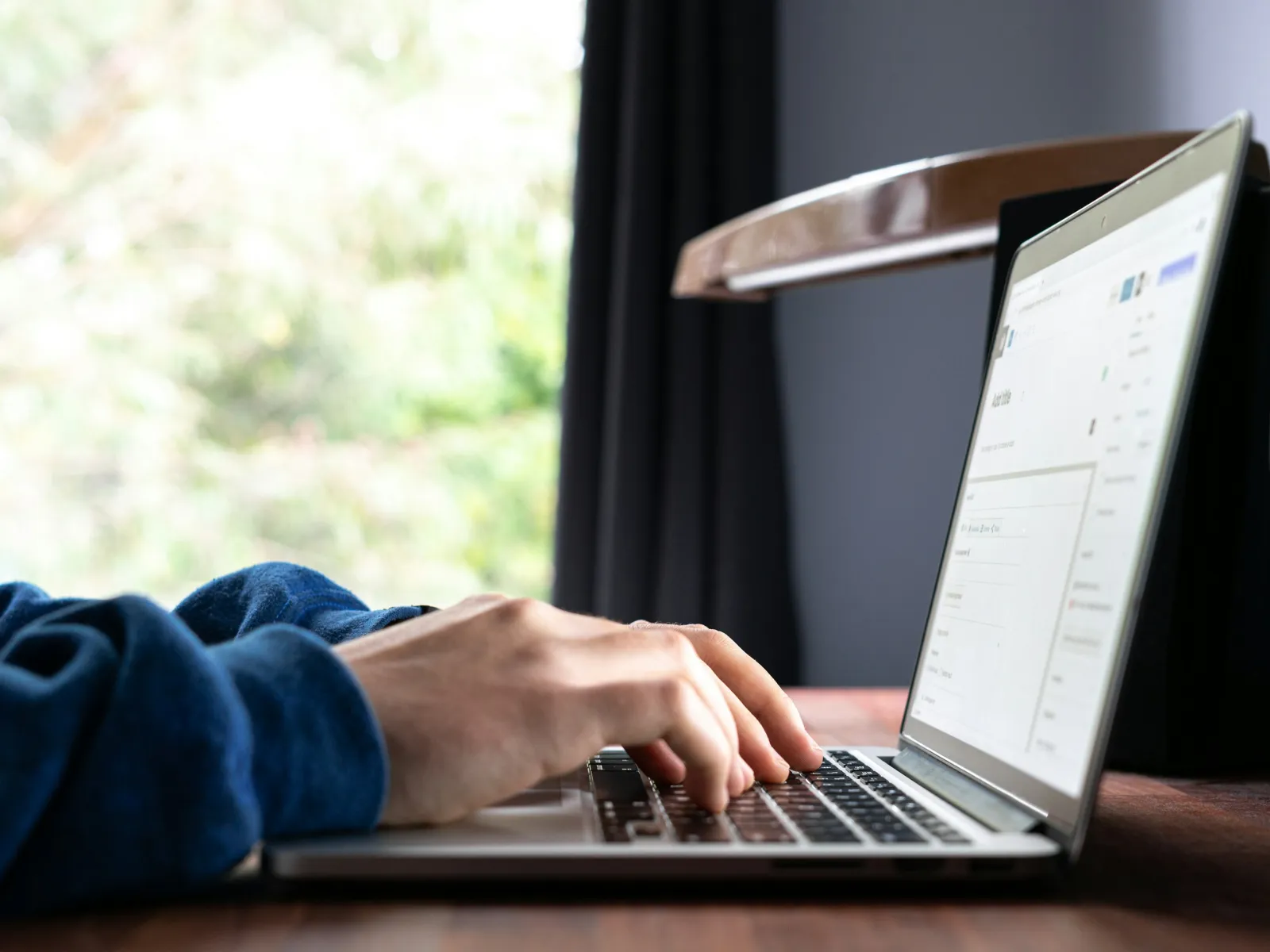 a person typing on a laptop