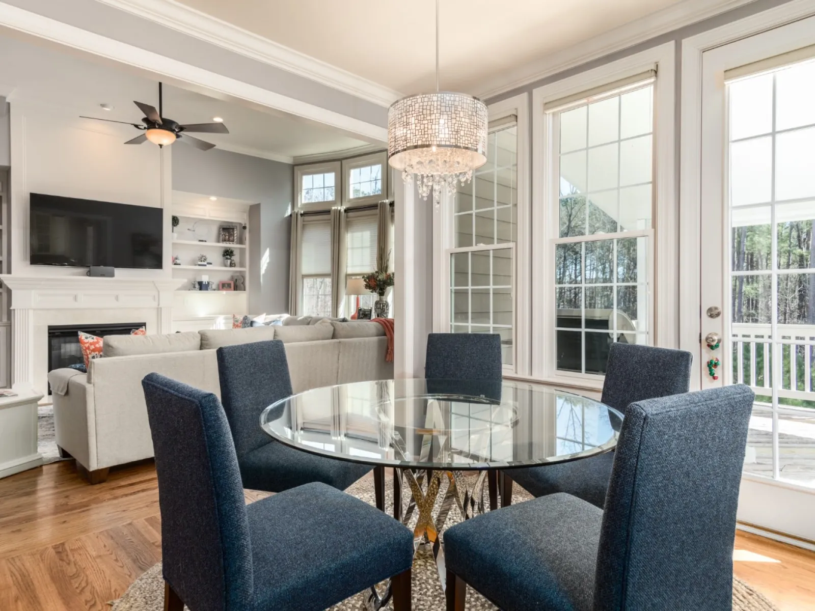 a living room filled with furniture and a large window
