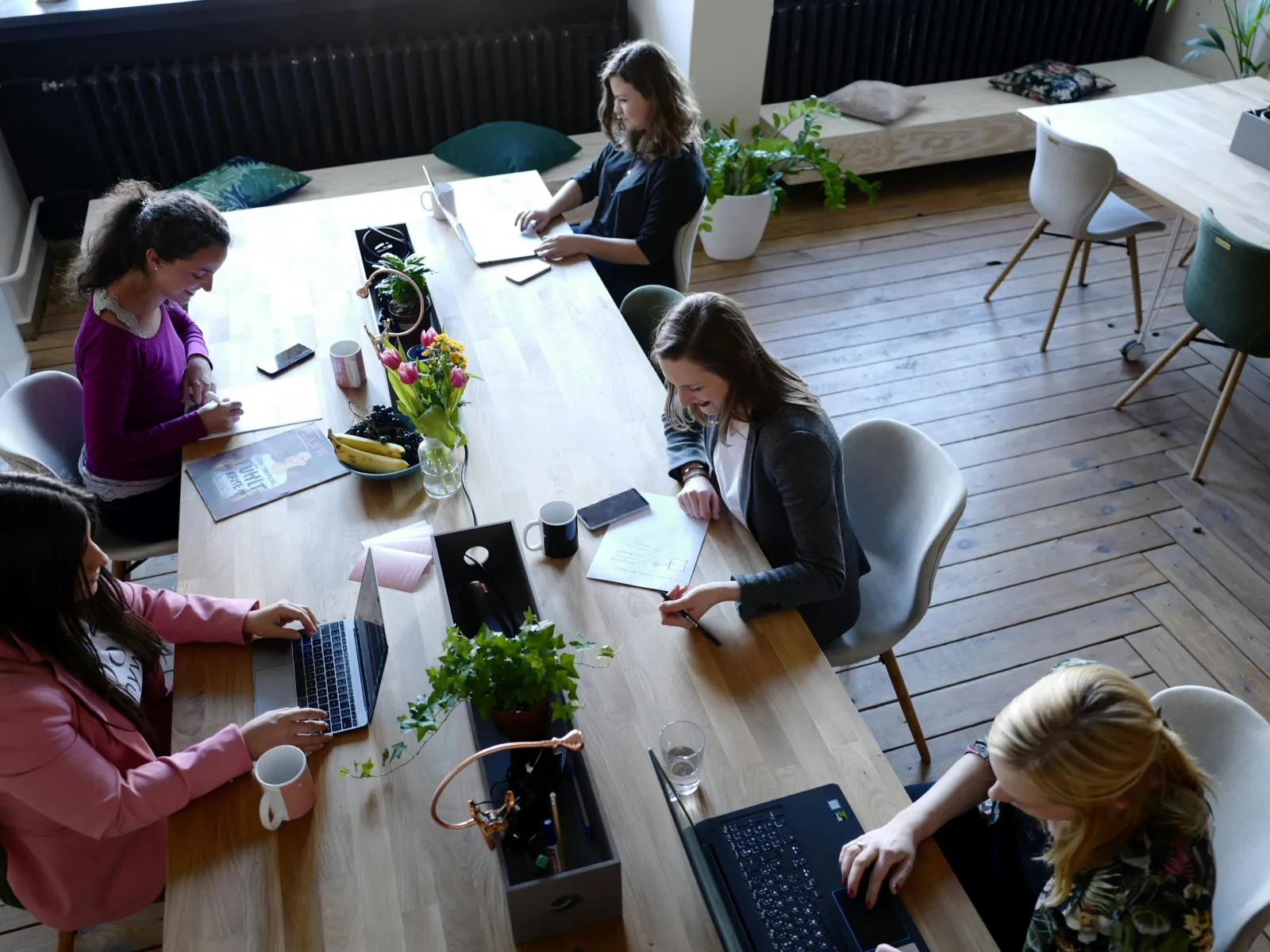 a group of women sitting around a table
