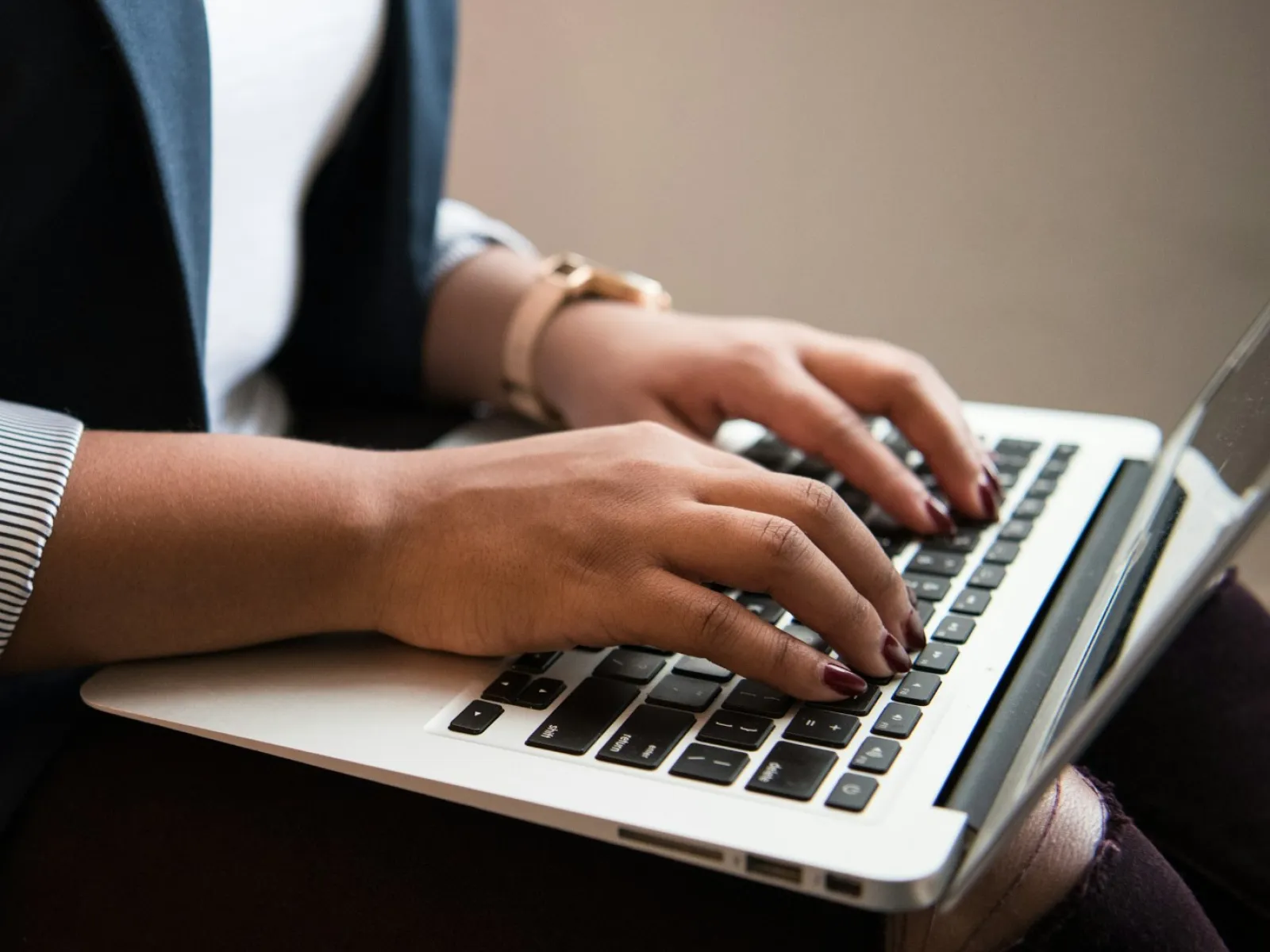 a woman wearing headphones and sitting at a desk