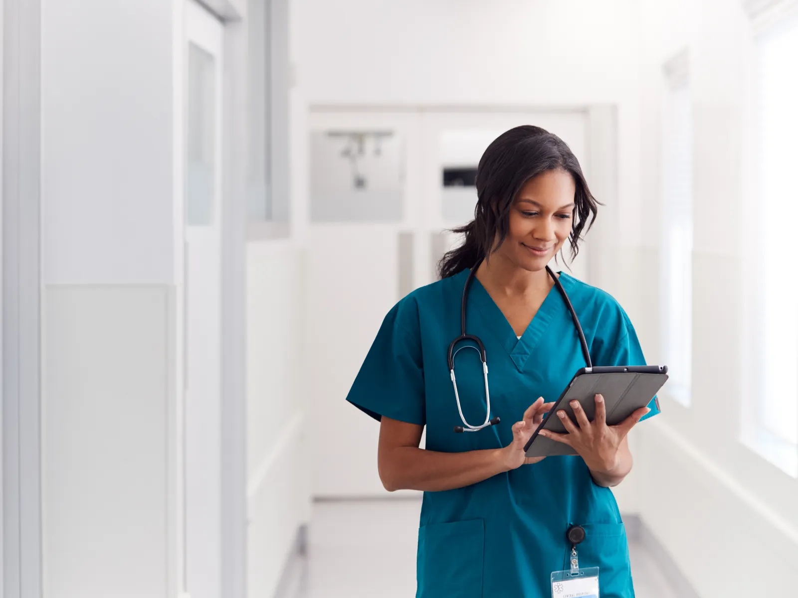 a nurse holding a tablet