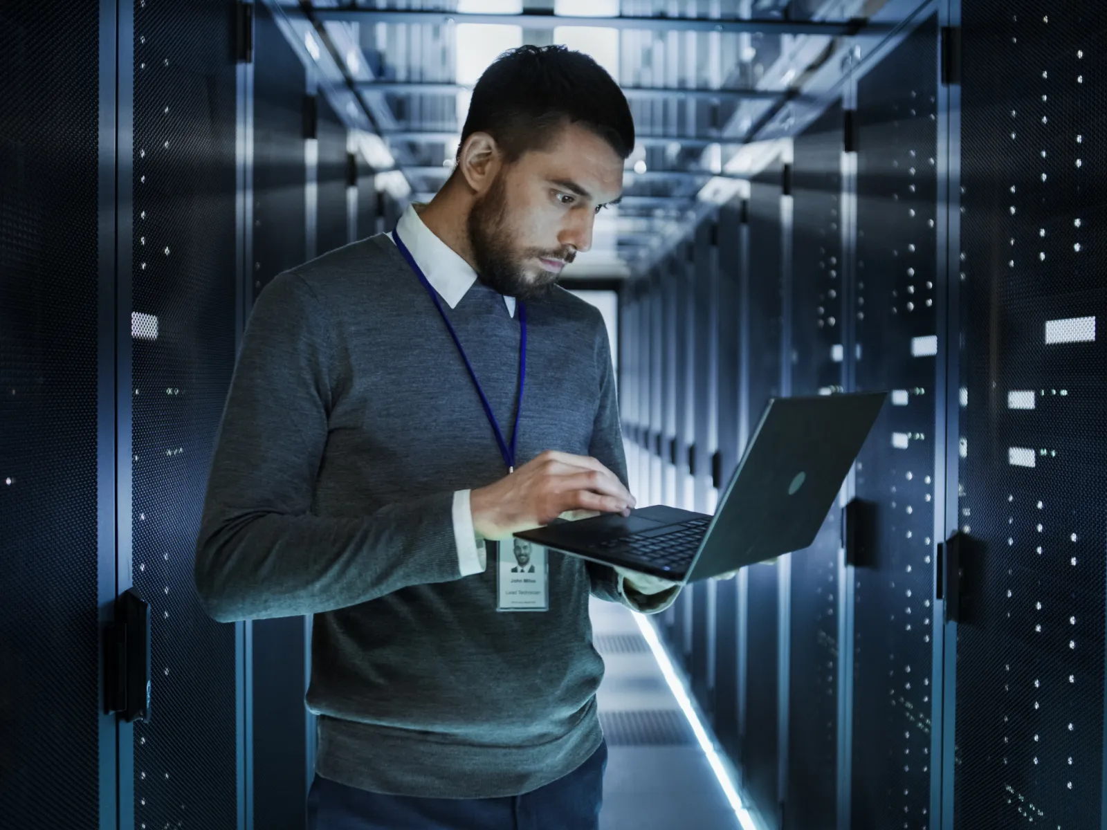 a man holding a laptop