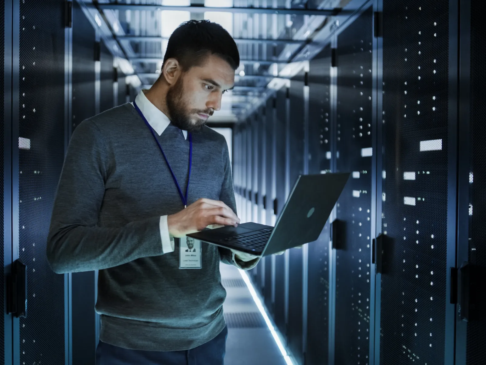 a man holding a laptop
