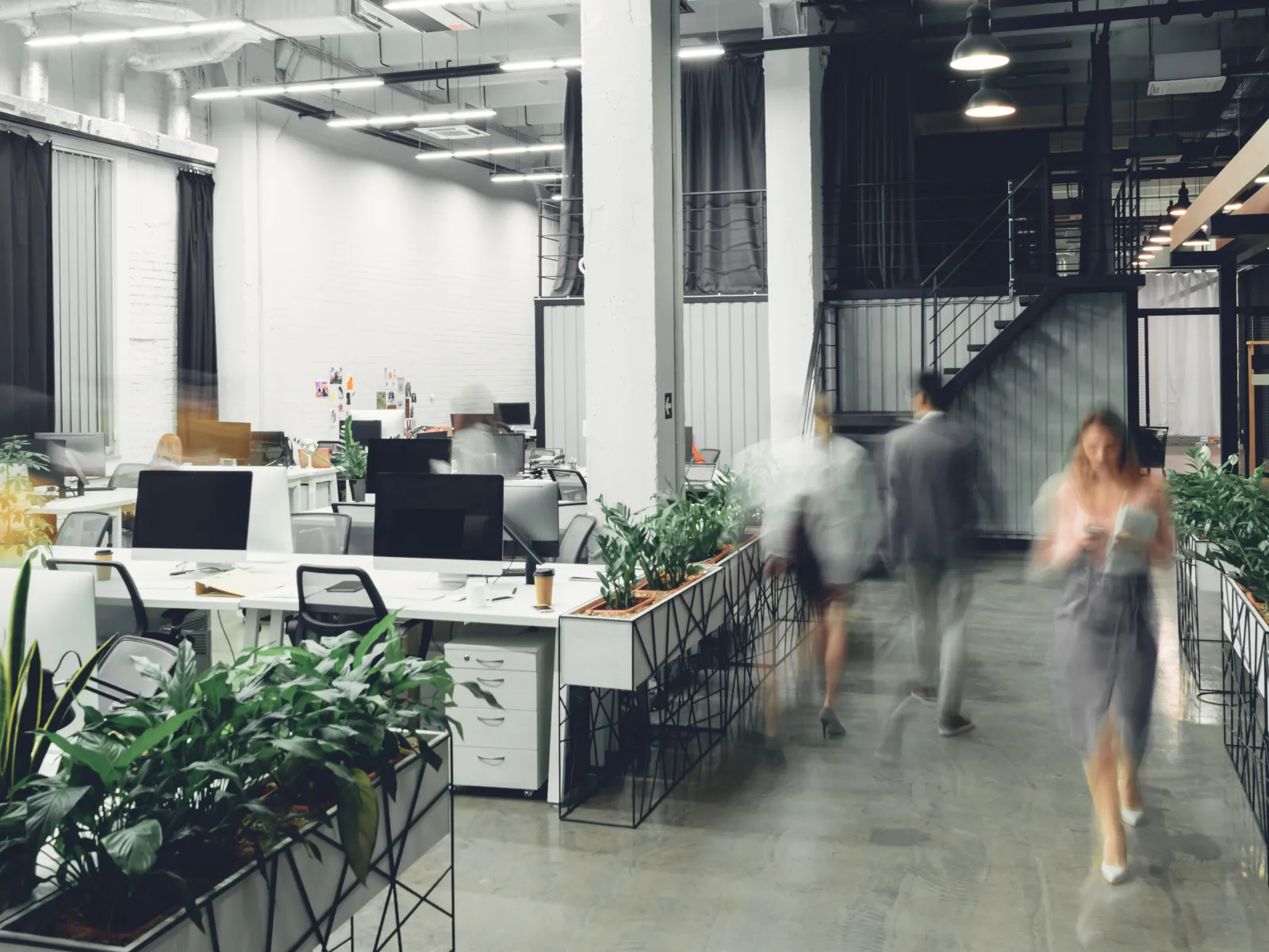 a group of people walking in a building